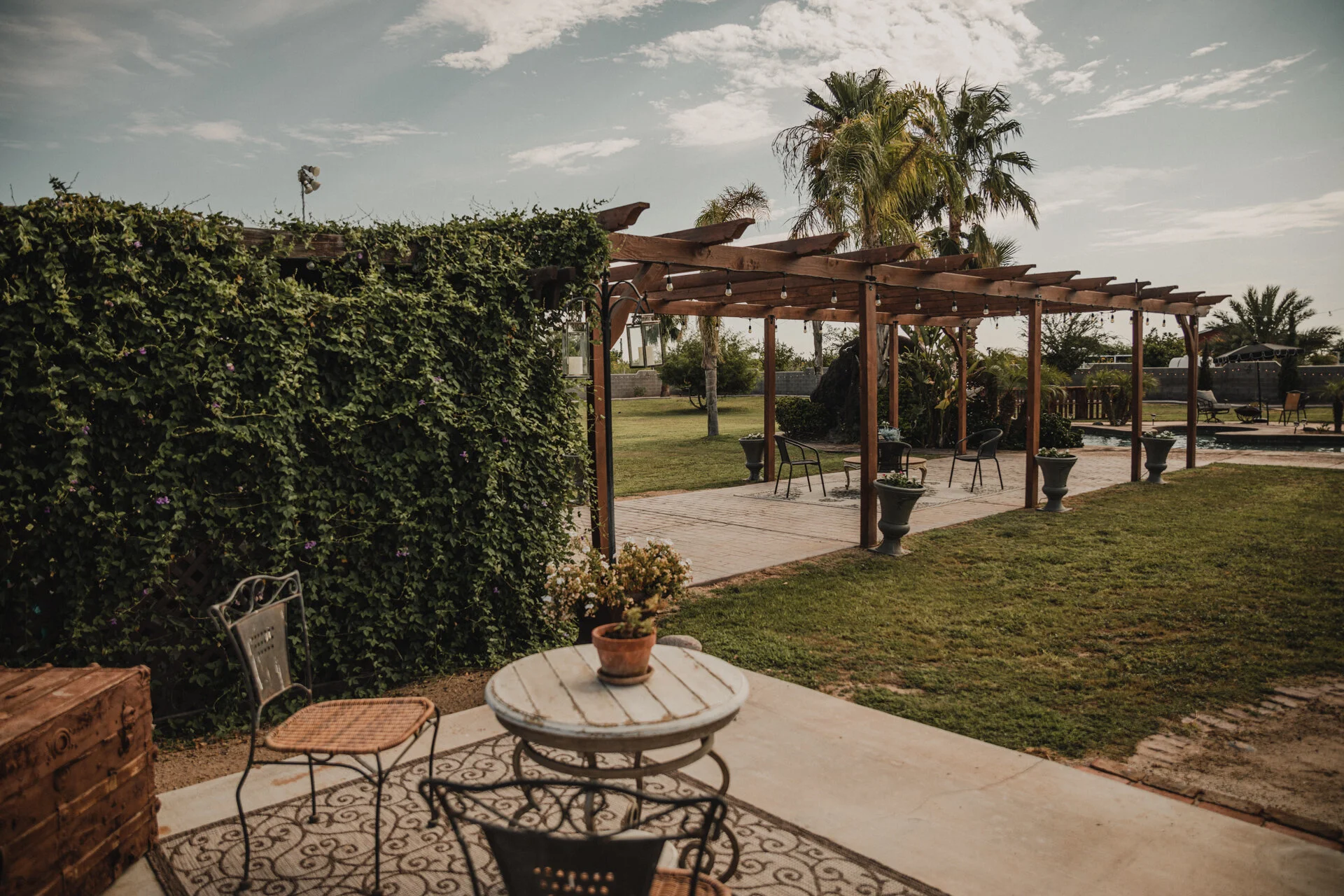 Outdoor reception tables arranged for an evening celebration.