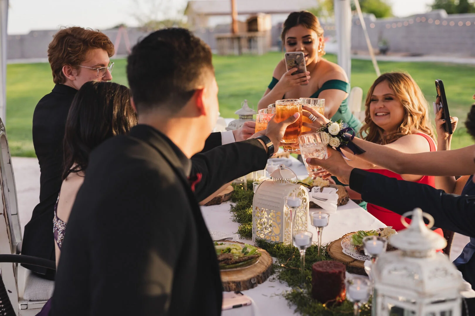 Guests enjoying cocktails during an outdoor celebration.
