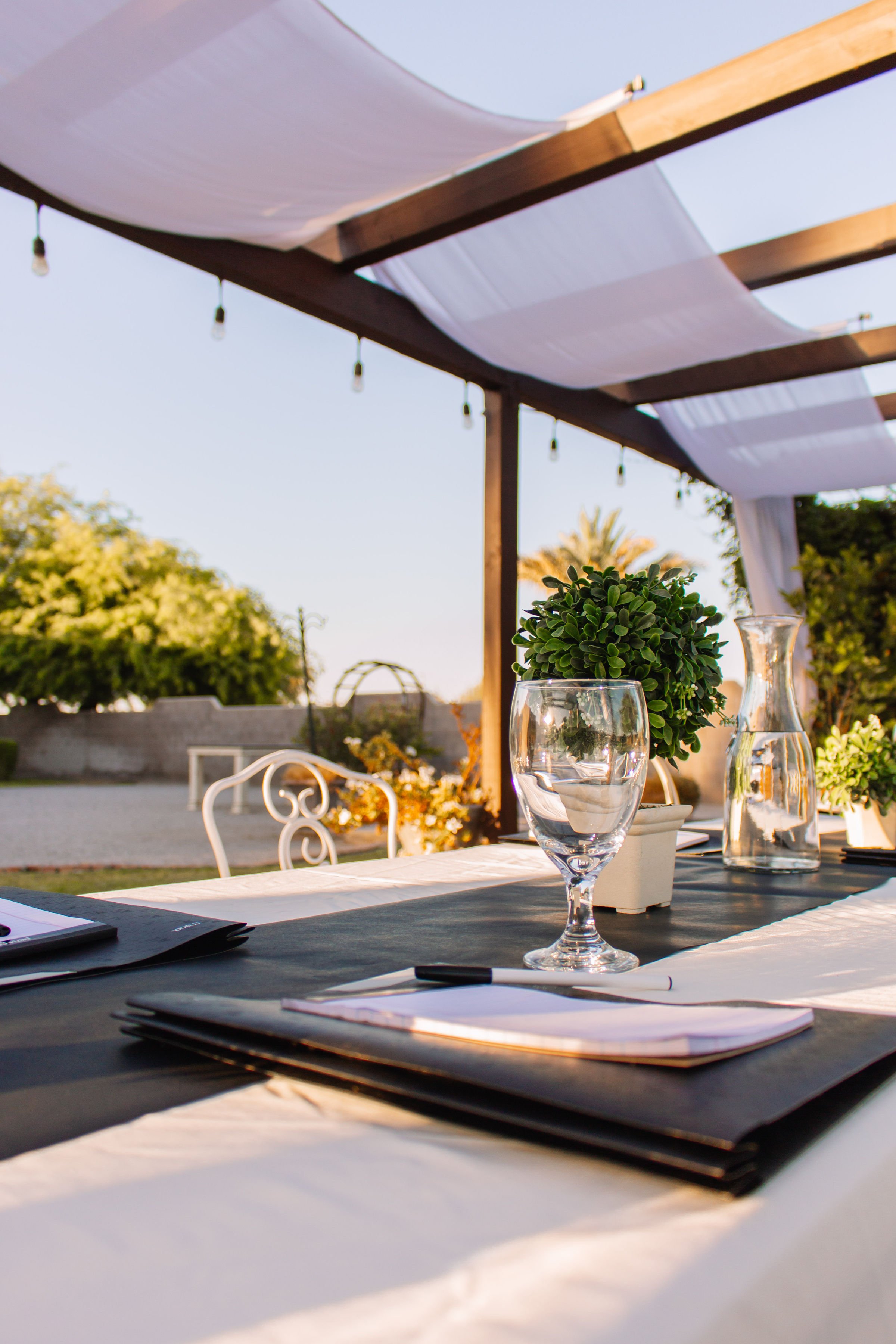 Professional conference table with elegant place settings at Villa de la Meza.