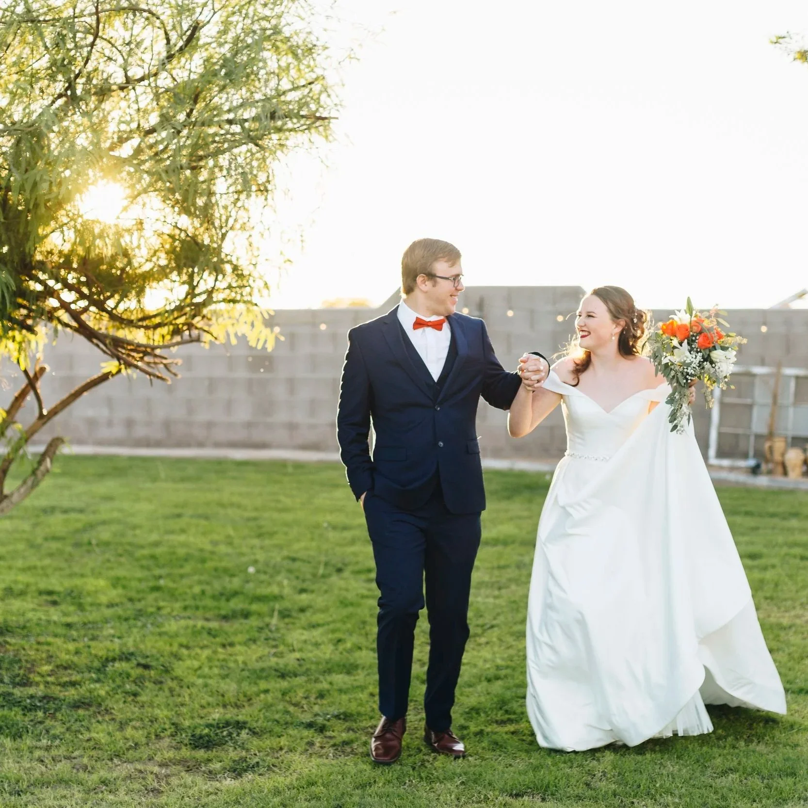 Bride and groom walking together after their wedding ceremony.