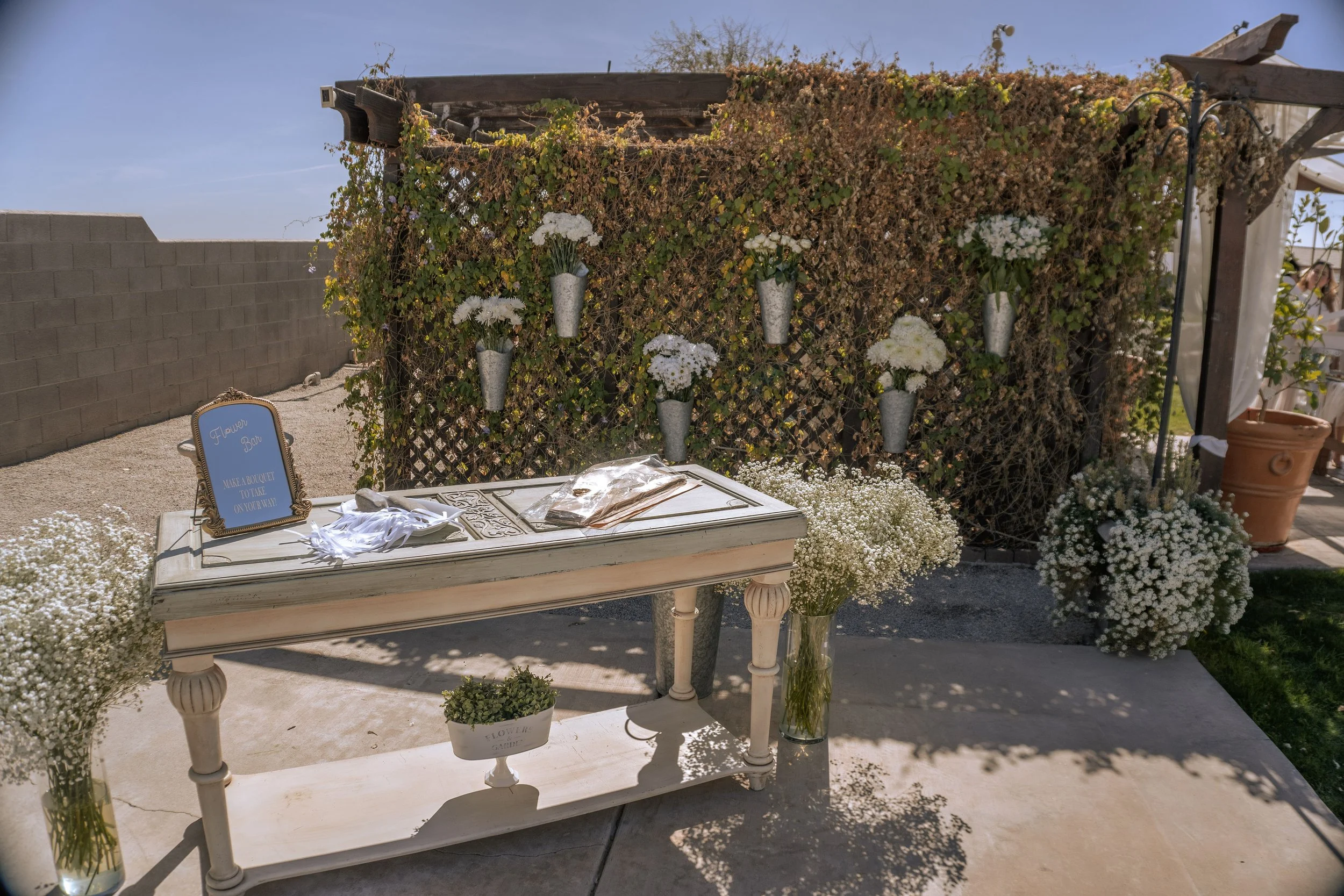 Flower bar prepared for wedding guests.