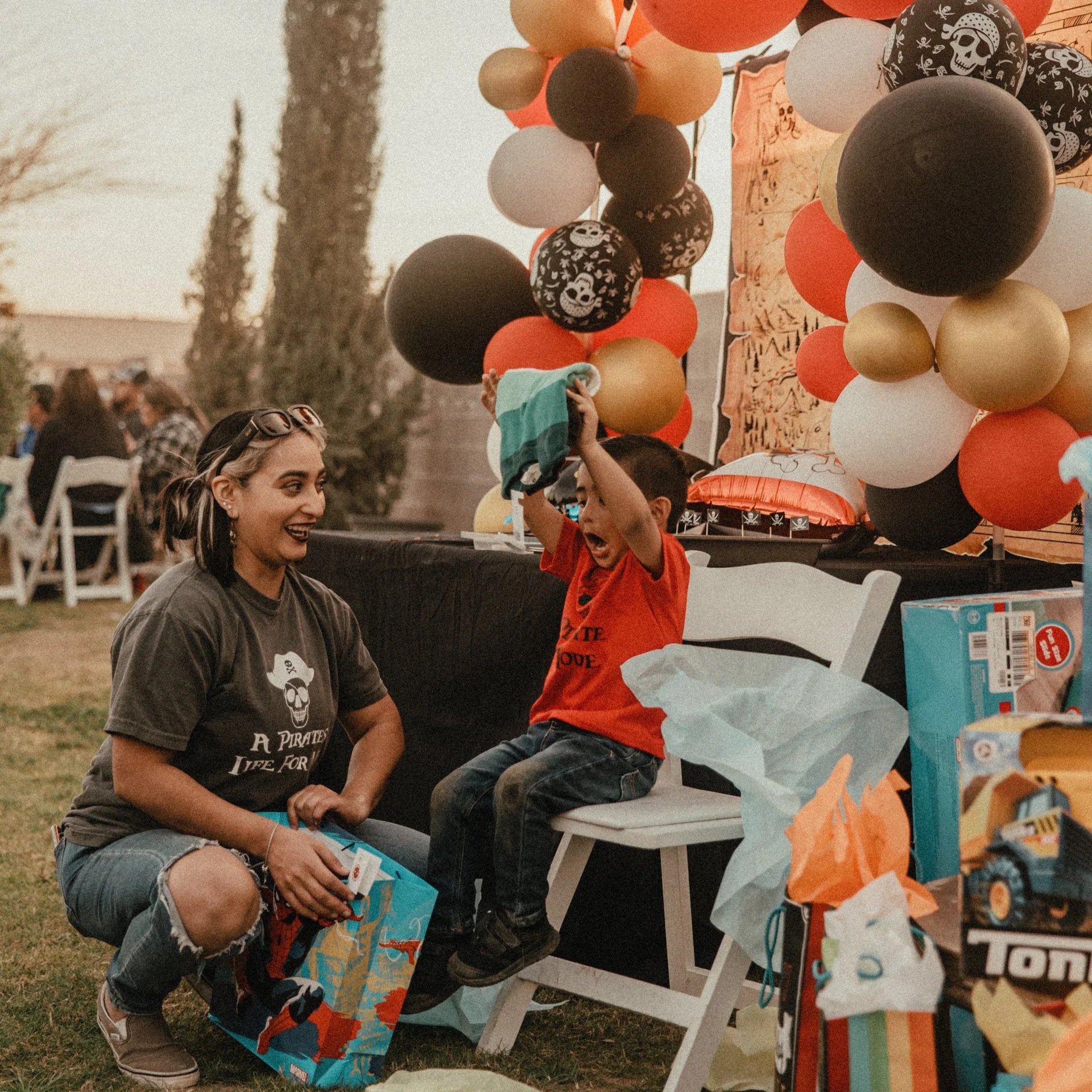 Child opening birthday gifts during a private celebration at Villa de la Meza.