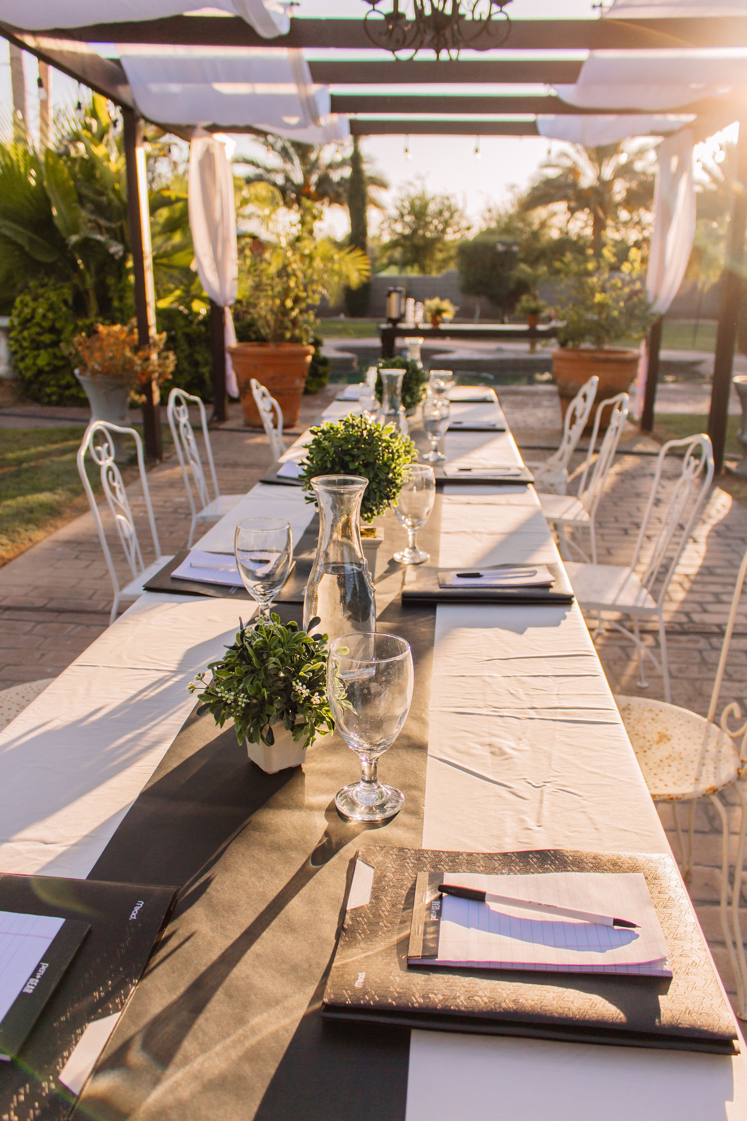 Corporate appreciation event décor with branded company centerpiece at Villa de la Meza.