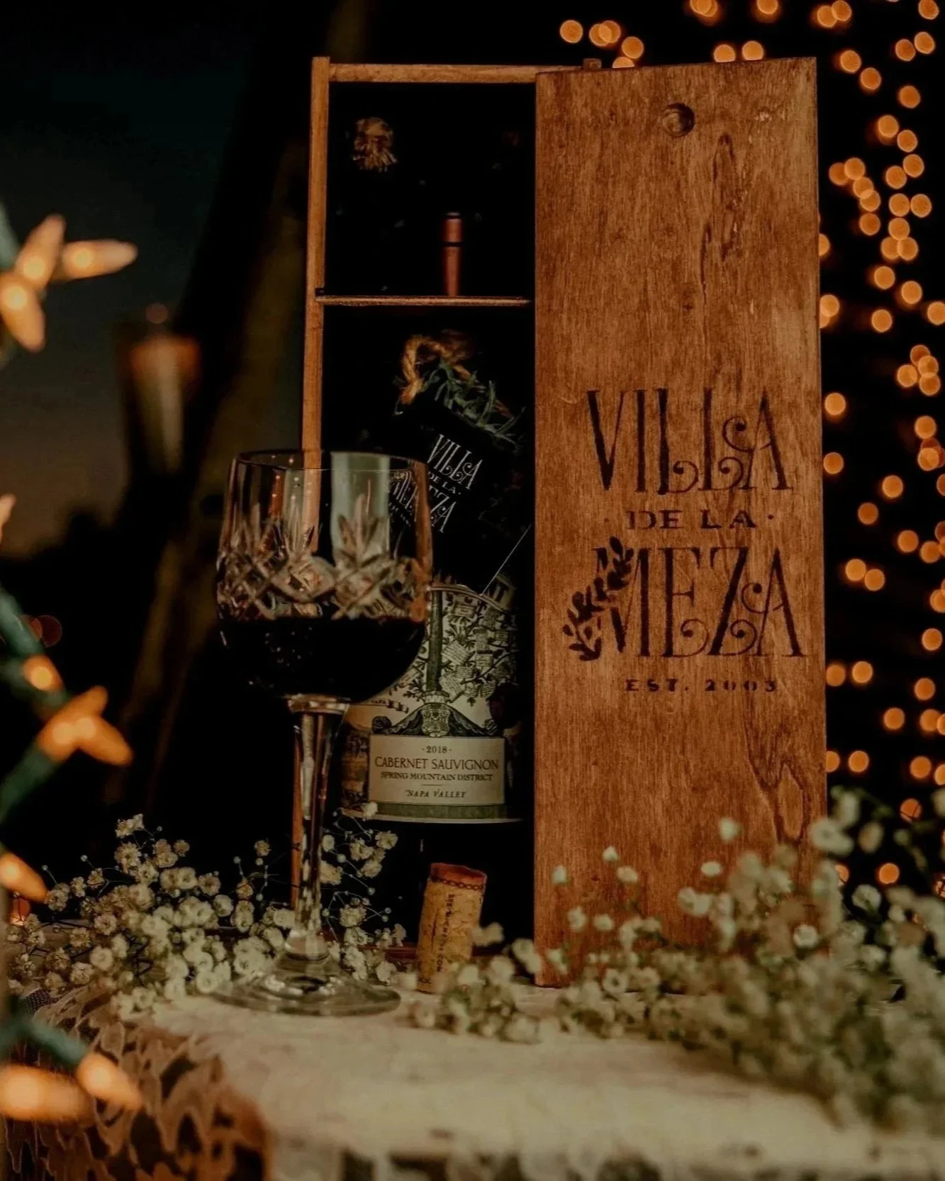 Signature Villa de la Meza wine box presented as a keepsake for wedding couples.