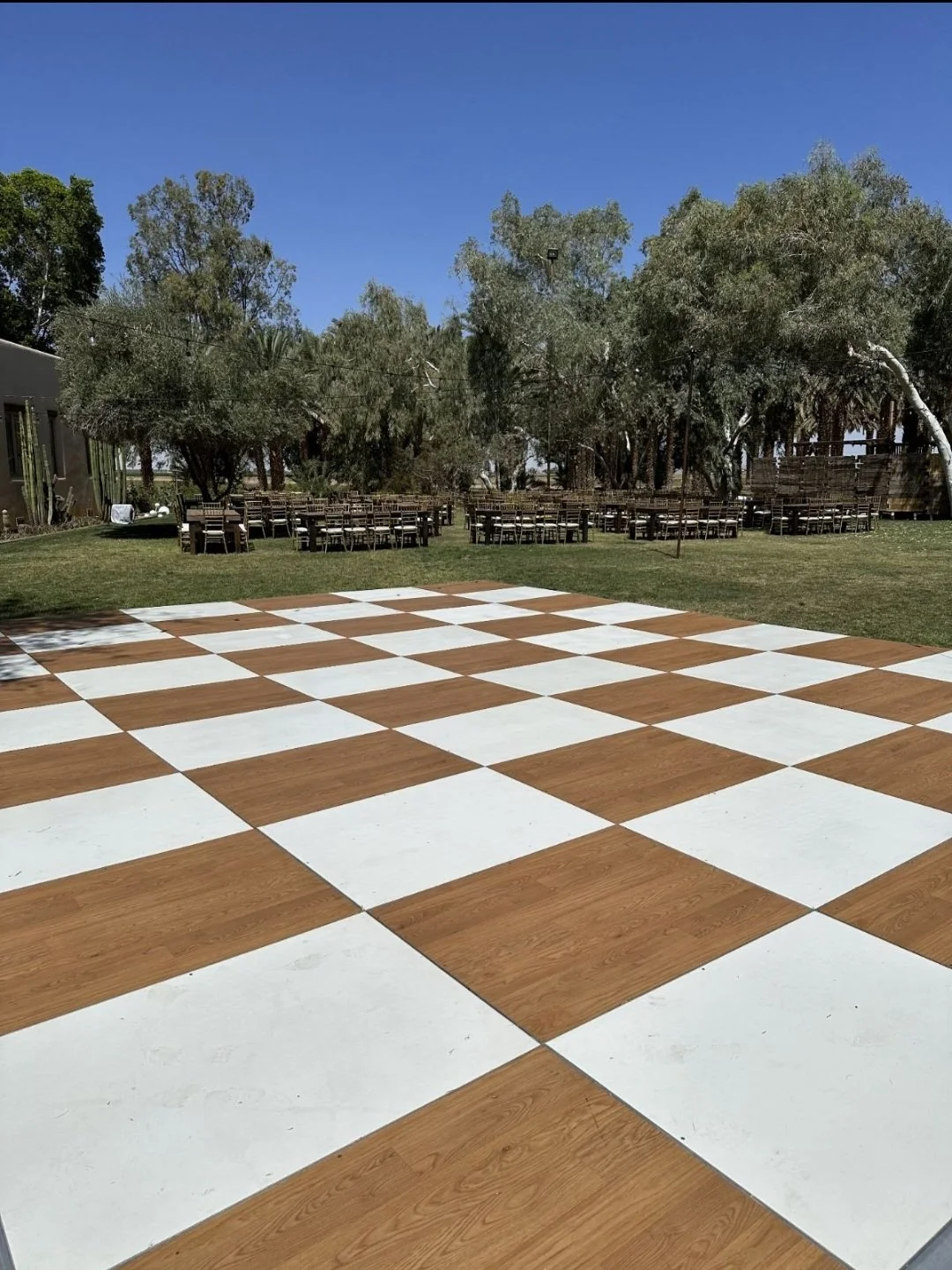 Outdoor dance floor ready for a reception.