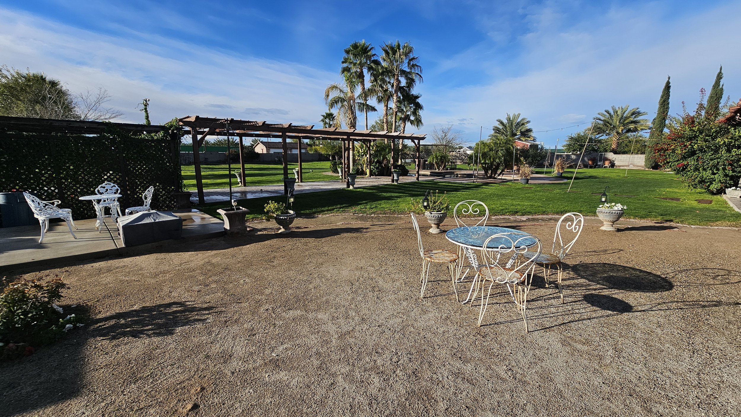 Wide view of Villa de la Meza's landscaped event grounds.