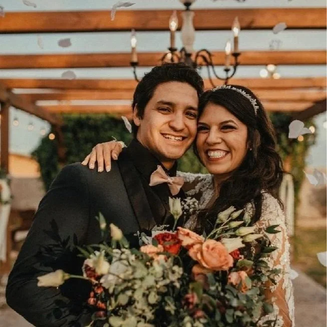 Newlyweds smiling together during their wedding celebration at Villa de la Meza.