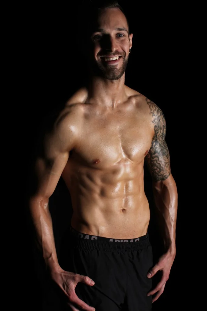 Smiling sweaty abs