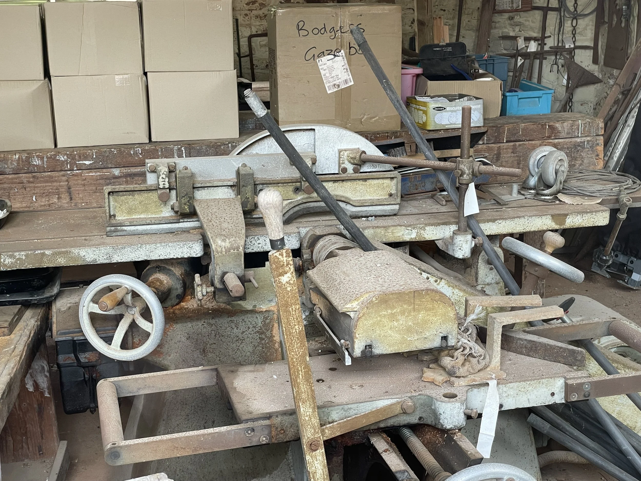 This machine could saw, cut, plane and mortise wood. It used to be kept in immaculate condition (even polished!). It's now very sad and neglected 