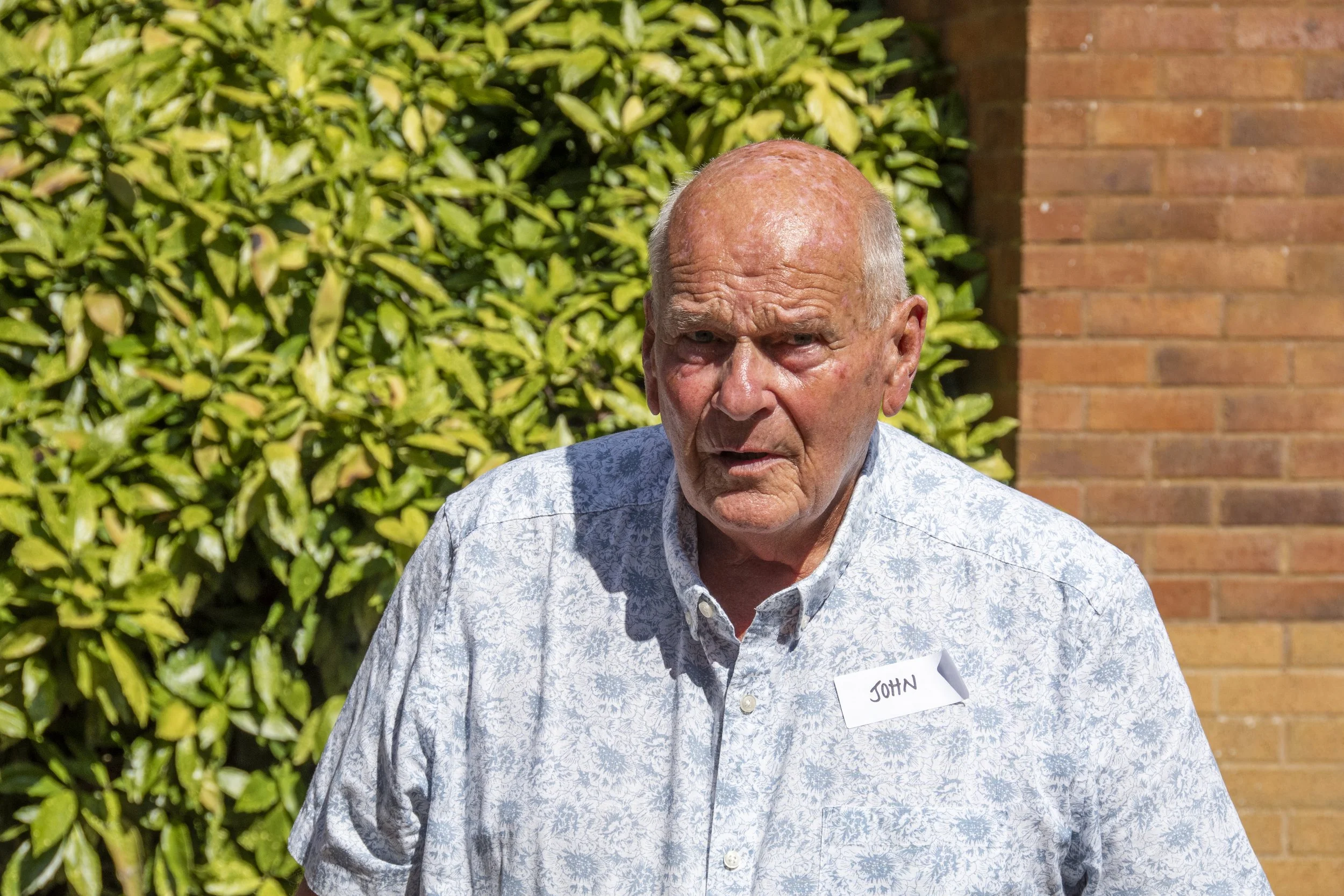 John looking like he has just remembered that he has to get up at 3am the following morning to go on holiday