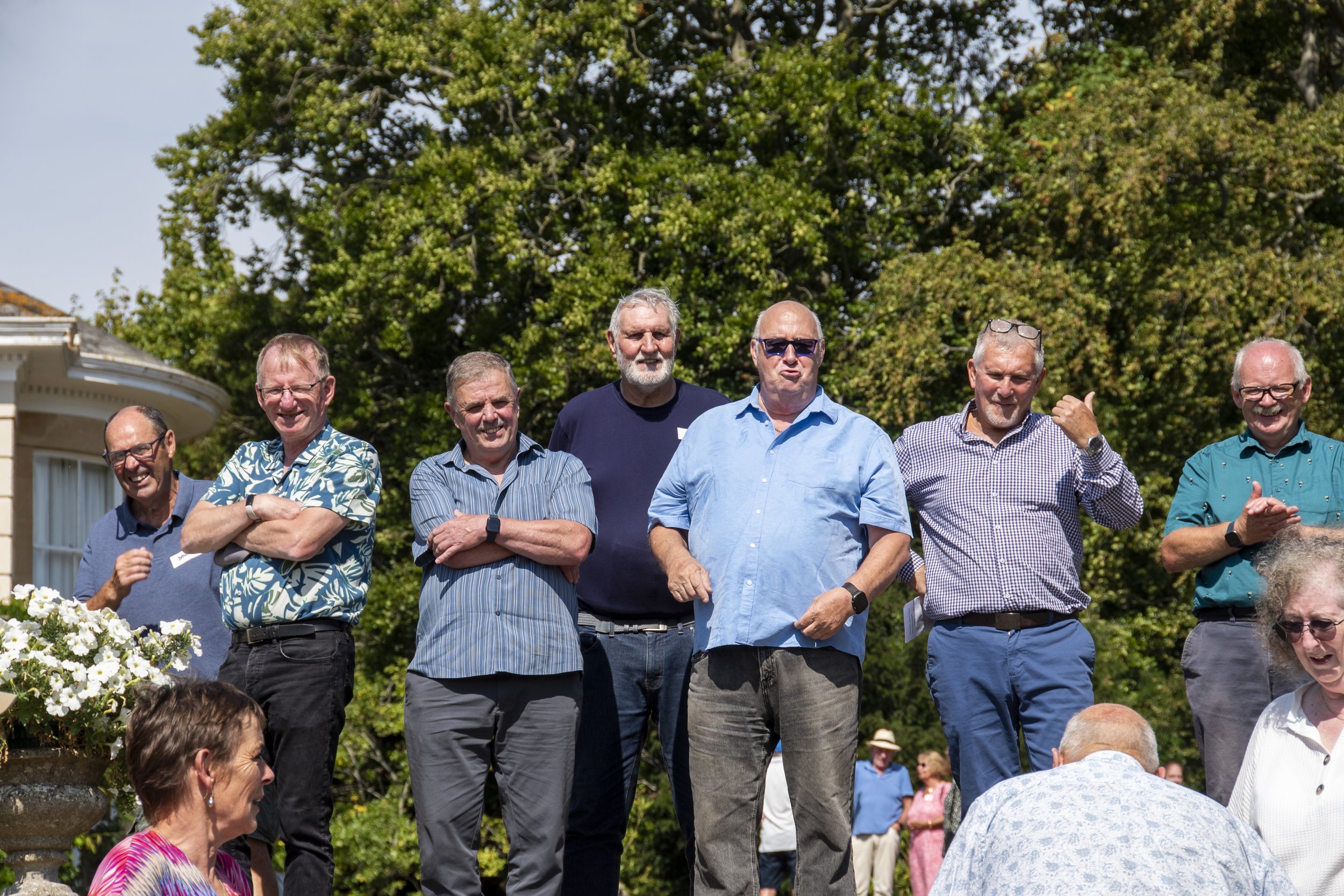 John Adams has just delivered the punch line in his story telling. Paul is clearly impressed, Andy is threatening to throw him off site, Jon is saying something rude. The rest can't believe it