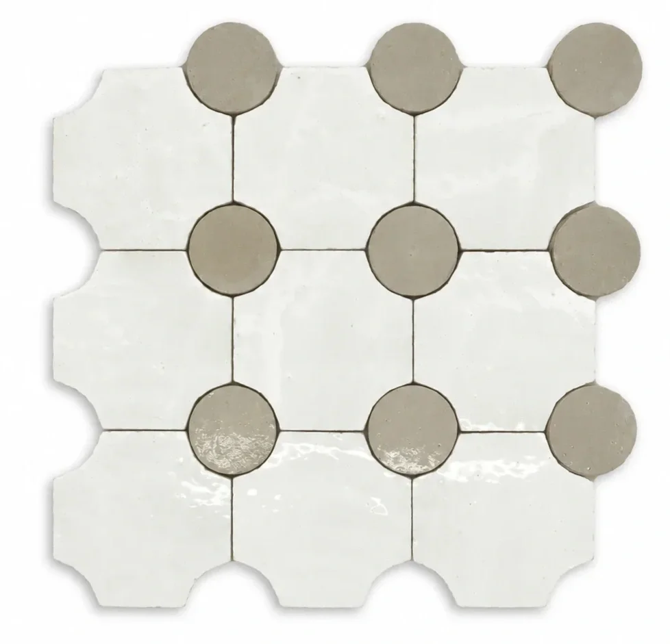 Tile floor with white square tiles and gray circular tiles arranged in a grid pattern.