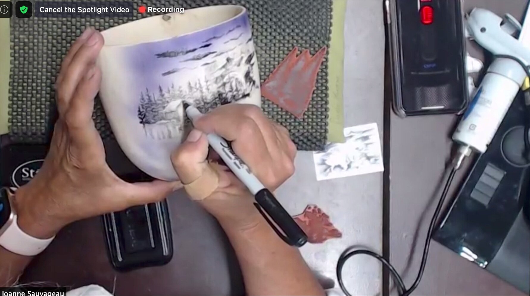 Filling in light areas of the stamp with a Sharpie marker allows you to add details.