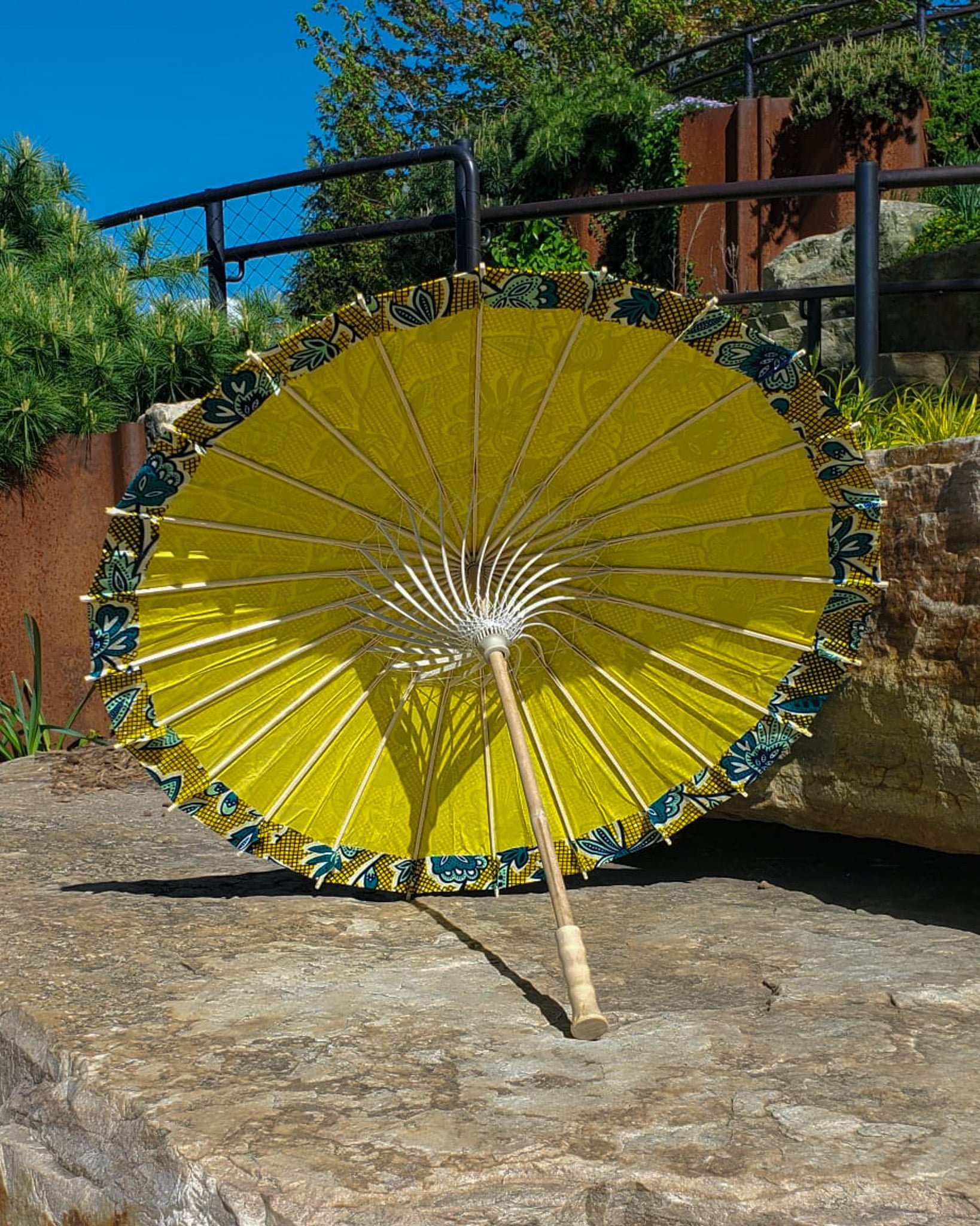 labradorite handmade parasol interior, medium size, with afro-inspired design on a stone slab