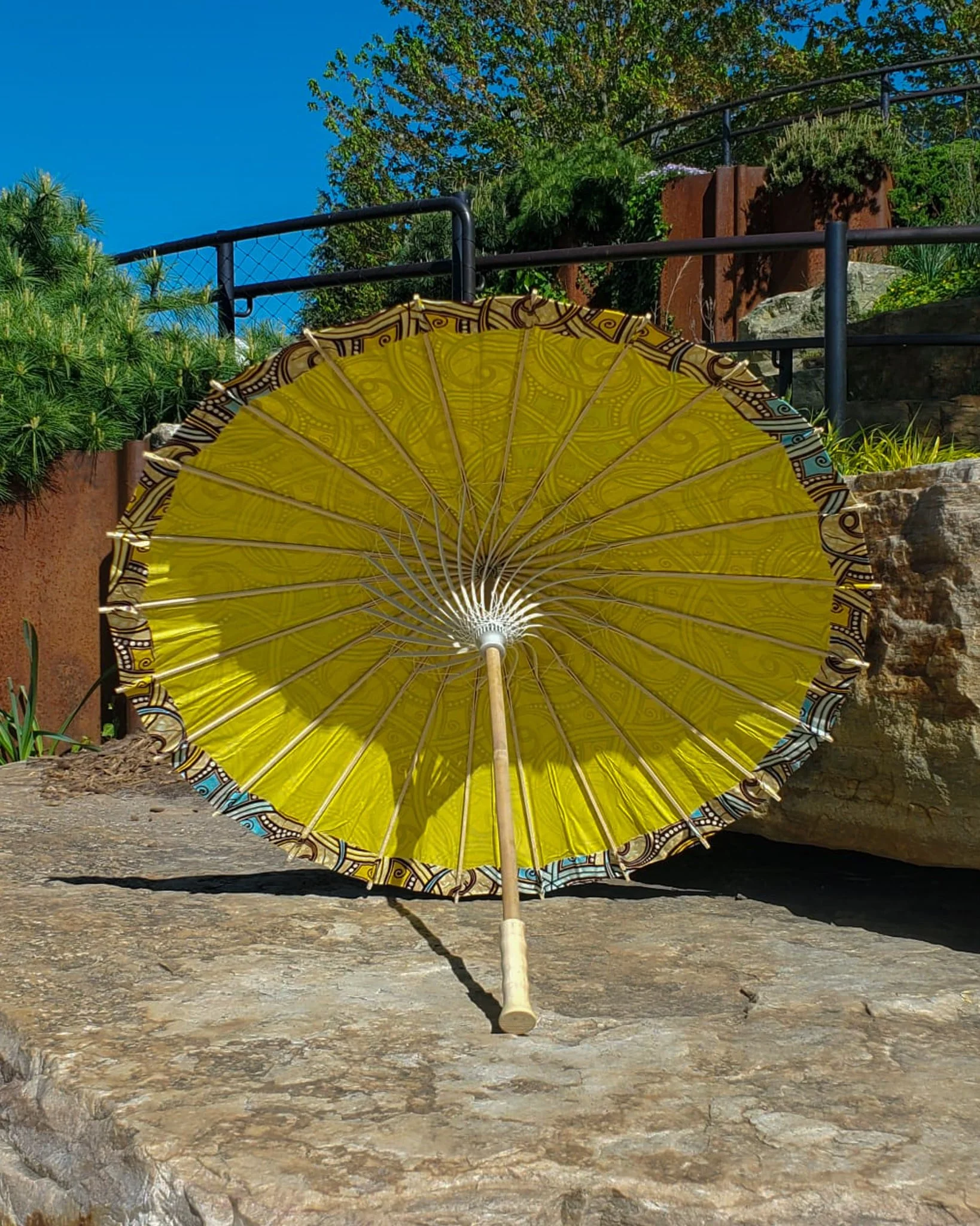 euclase handmade parasol interior, medium size, with afro-inspired design on a stone slab