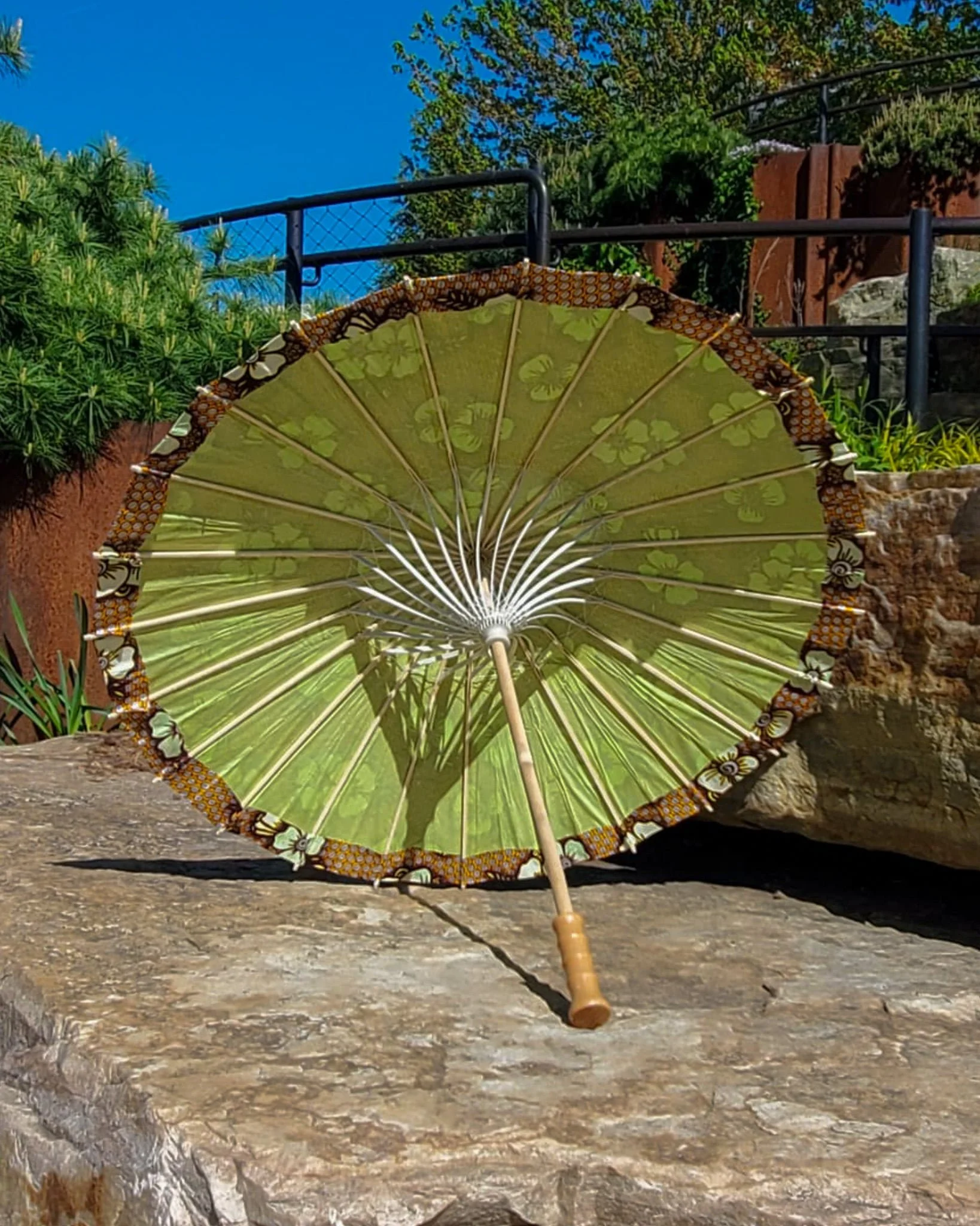 lions gate quartz handmade parasol interior, medium size, with afro-inspired design on a stone slab