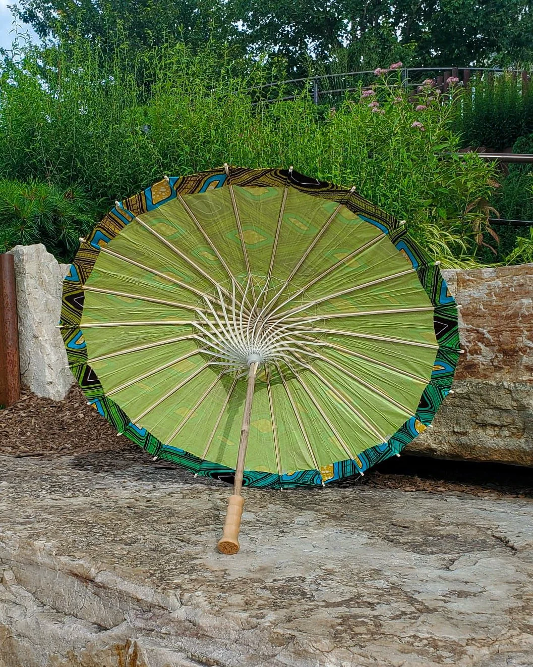 gaspeite handmade parasol interior, medium size, with afro-inspired design on a stone slab
