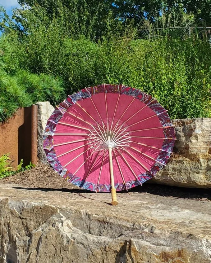 chalcopyrite handmade parasol interior, medium size, with afro-inspired design on a stone slab