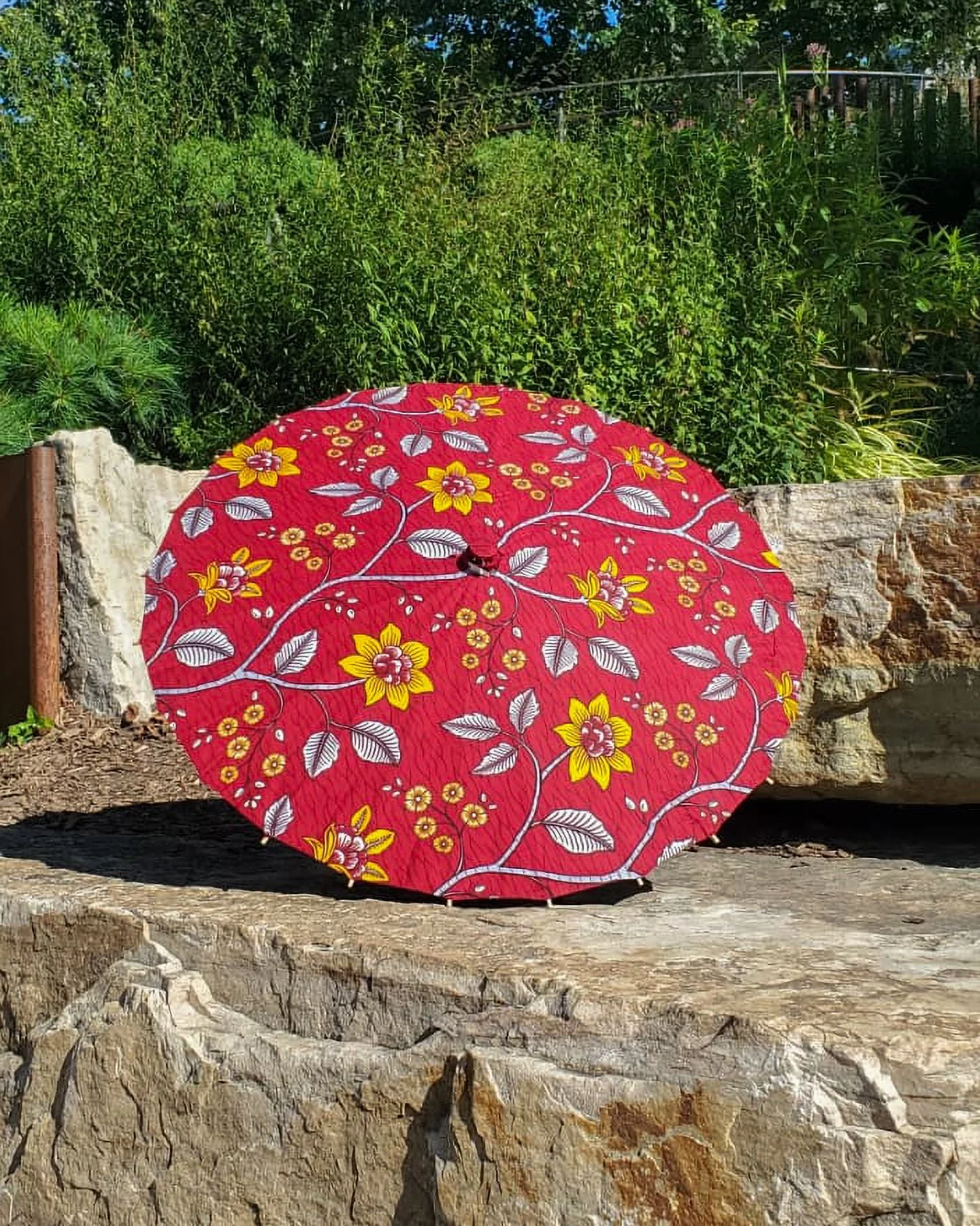 mookaite handmade parasol exterior, medium size, with afro-inspired design on a stone slab