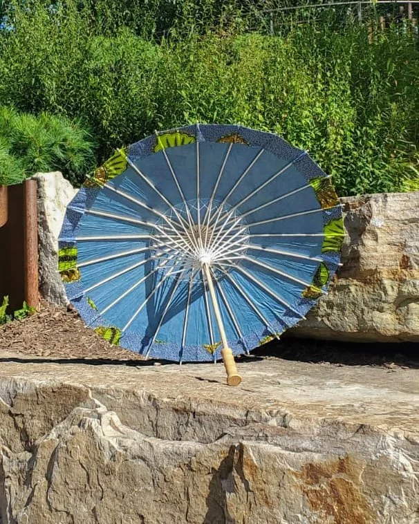 azurmalachite handmade parasol interior, medium sized, with afro-inspired design on a stone slab