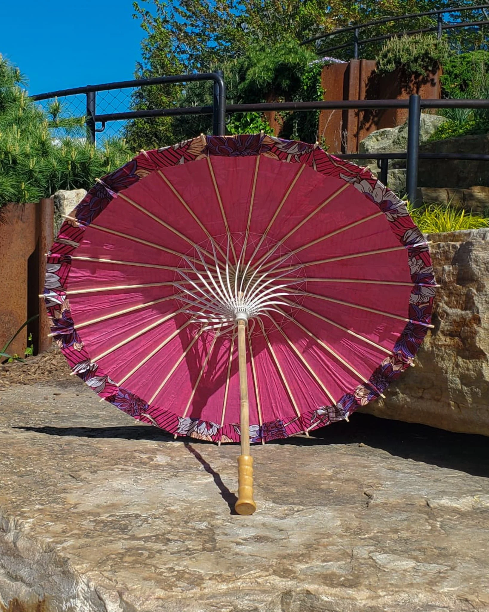 lepidolite handmade parasol interior, medium size, with afro-inspired design on a stone slab