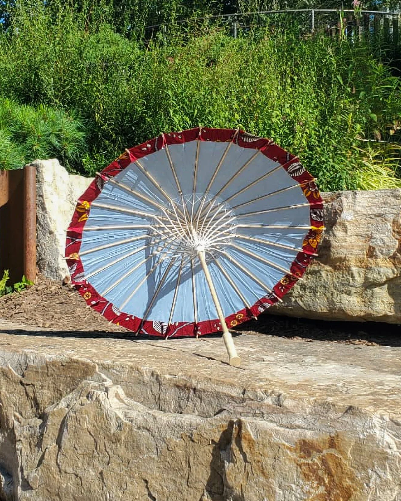 mookaite handmade parasol interior, medium size, with afro-inspired design on a stone slab