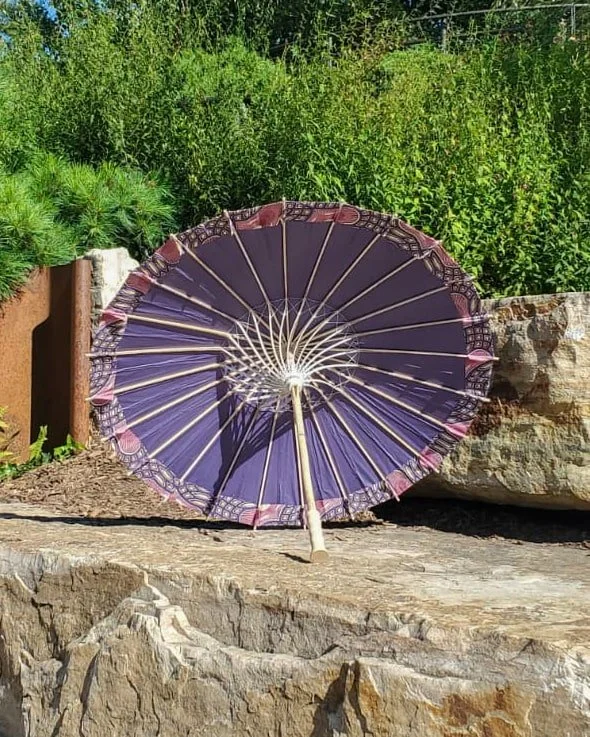 grape agate handmade parasol interior, medium size, with afro-inspired design on a stone slab