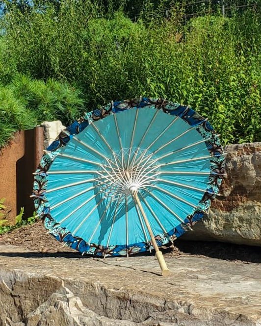 blue apatite hand made parasol interior, medium size, with afro-inspired design on a stone slab