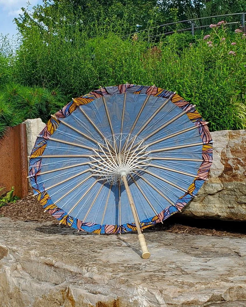 phosphosiderite handmade parasol interior, medium size, with afro-inspired design on a stone slab
