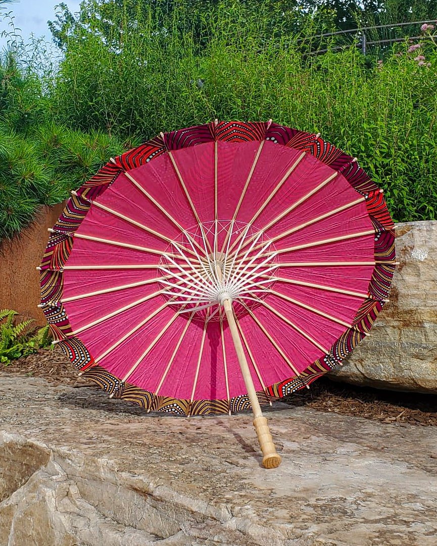 erythrite handmade parasol interior, medium size, with afro-inspired design on a stone slab