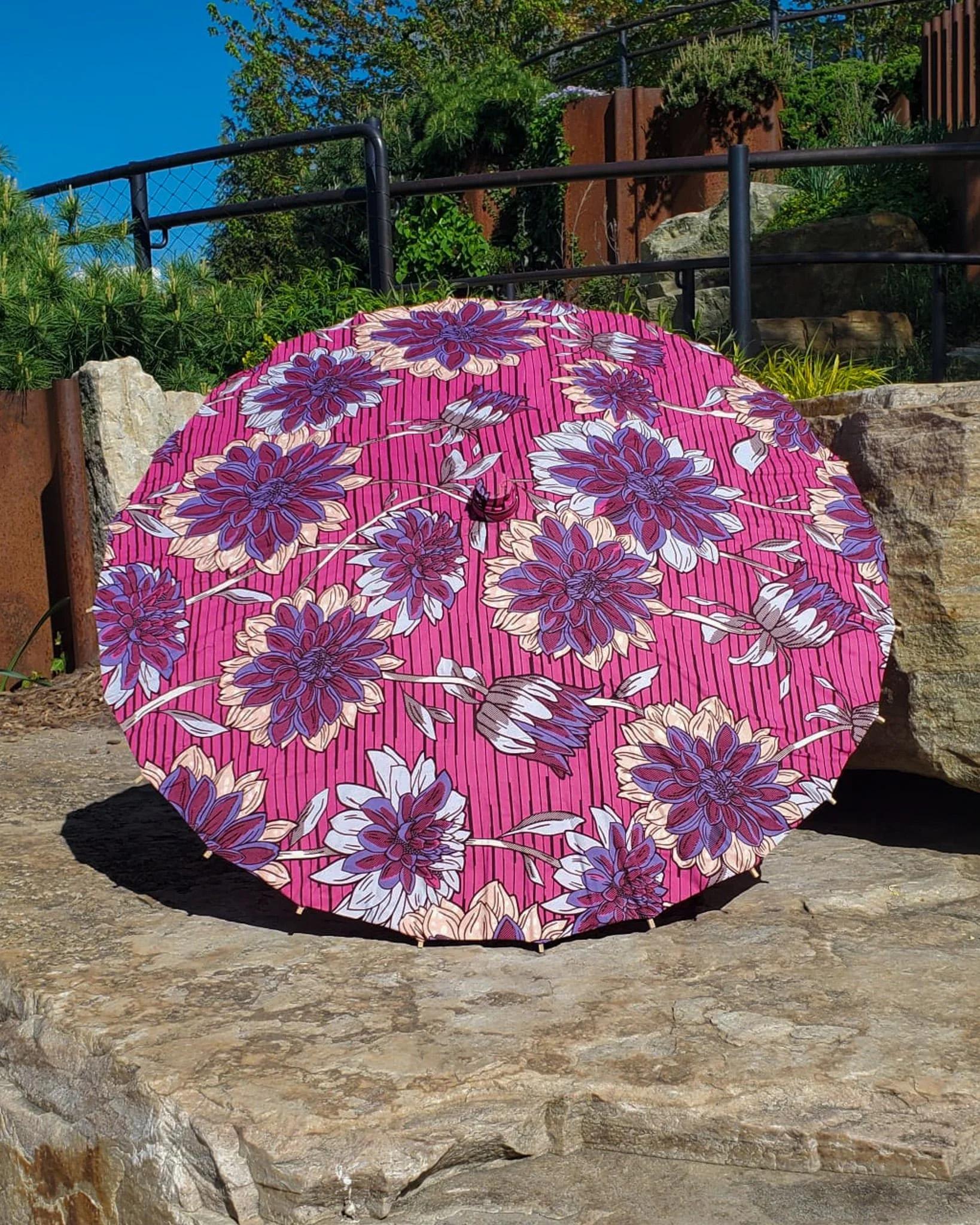 lepidolite handmade parasol exterior, medium size, with afro-inspired design on a stone slab