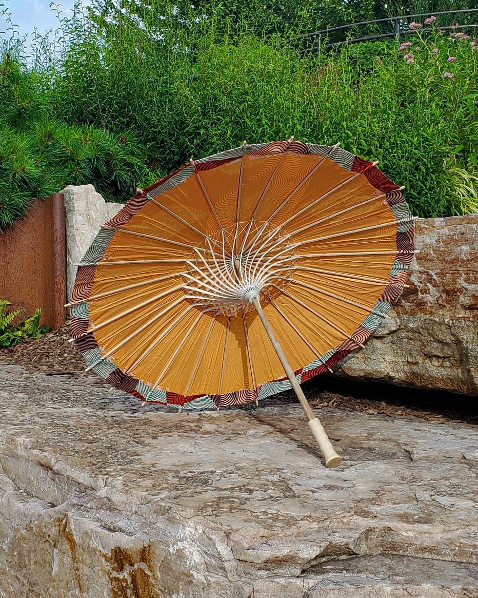 copper handmade parasol interior, medium size, with afro-inspired design on a stone slab