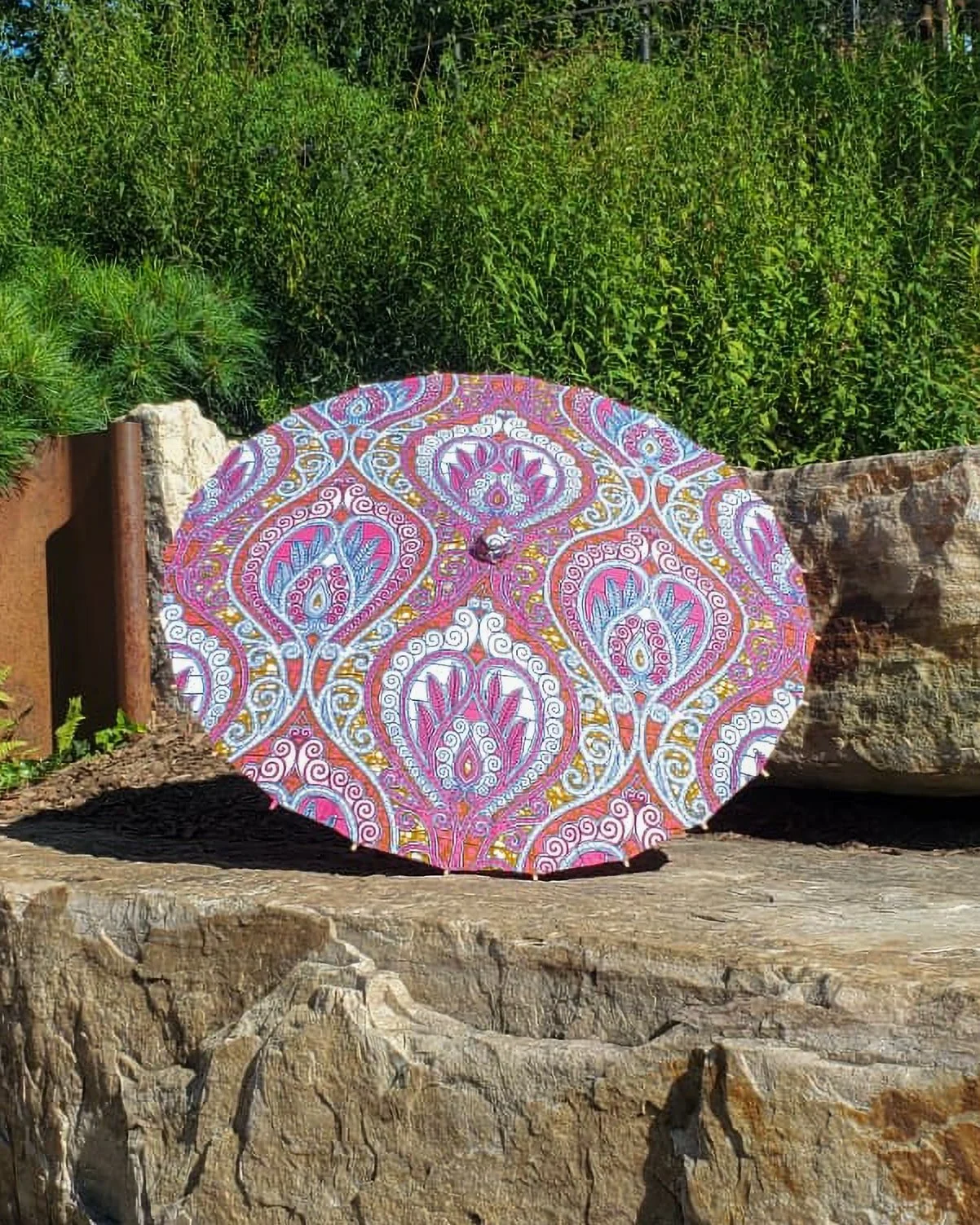 chalcopyrite handmade parasol exterior, medium size, with afro-inspired design on a stone slab