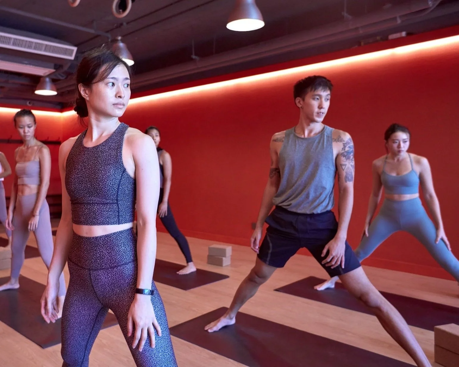 A mixed group practising yoga at IKIGAI Hong Kong