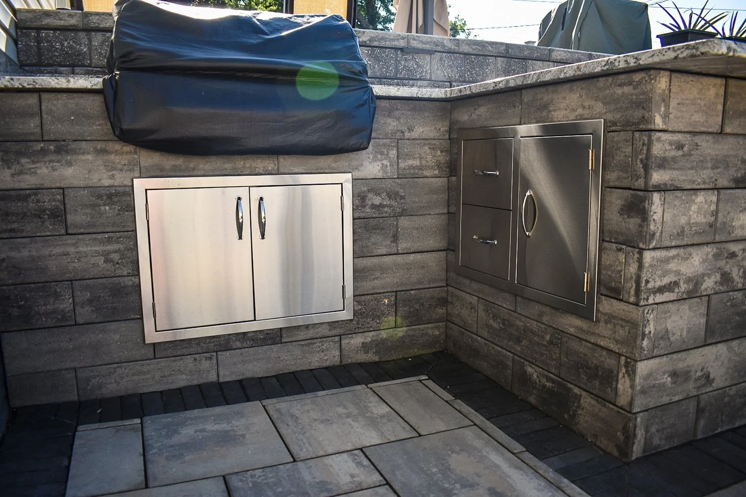 Entertain in Style With a Custom Outdoor Kitchen Under a Pavilion in the Woodhaven, MI Area