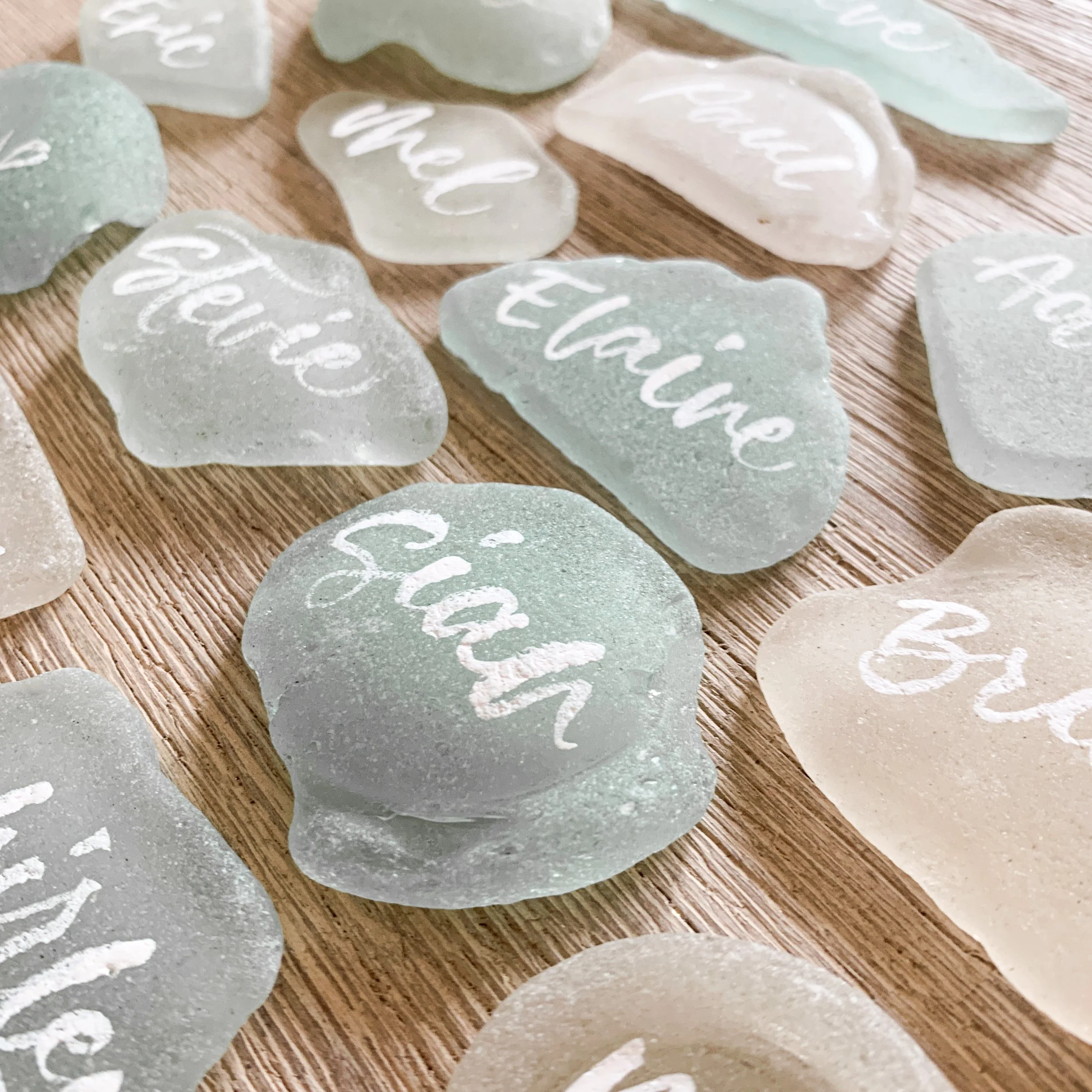 Seaglass and white brush lettered calligraphy names. My absolute favourite to date! 