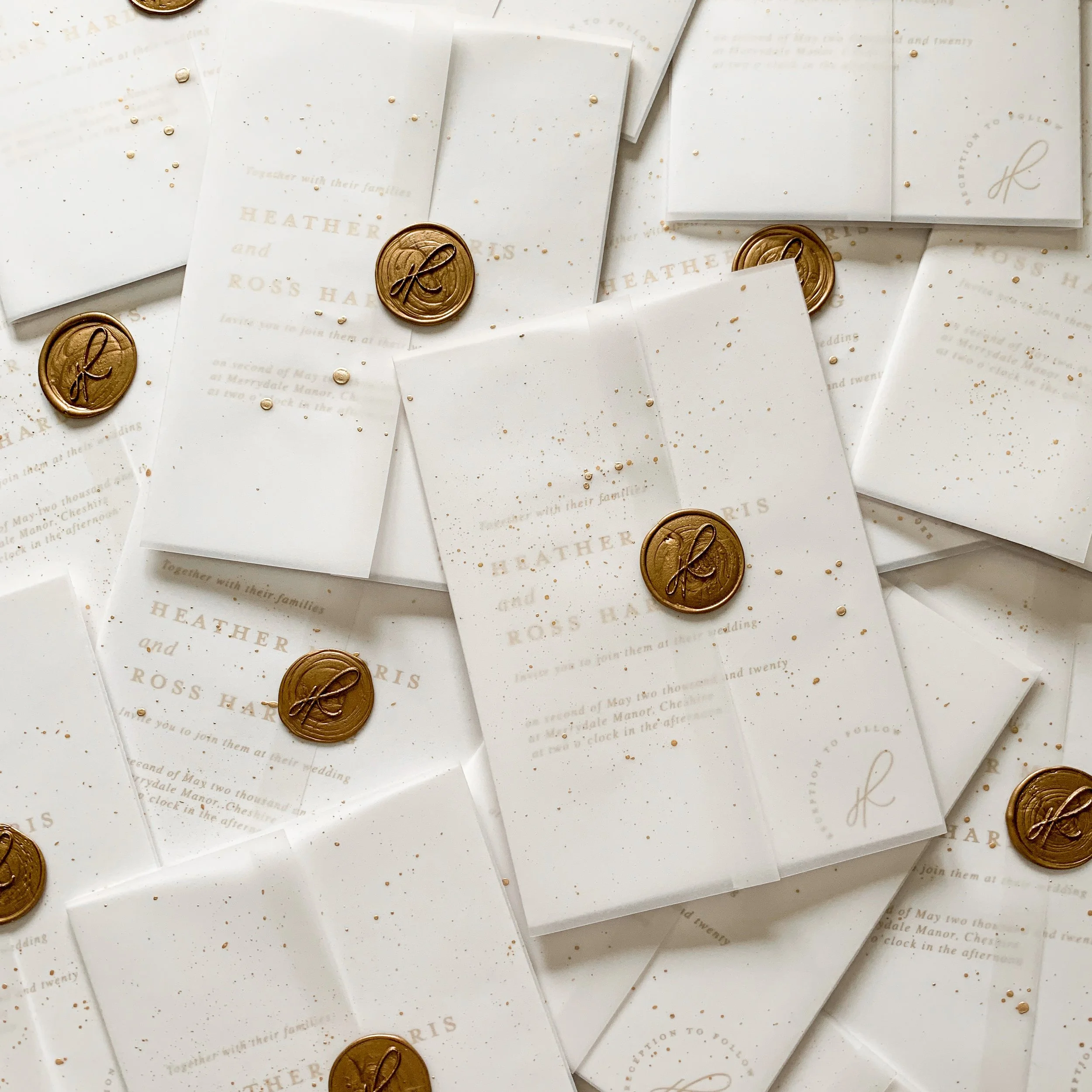 A simple vellum wrap with a wax seal and gold speckled paint