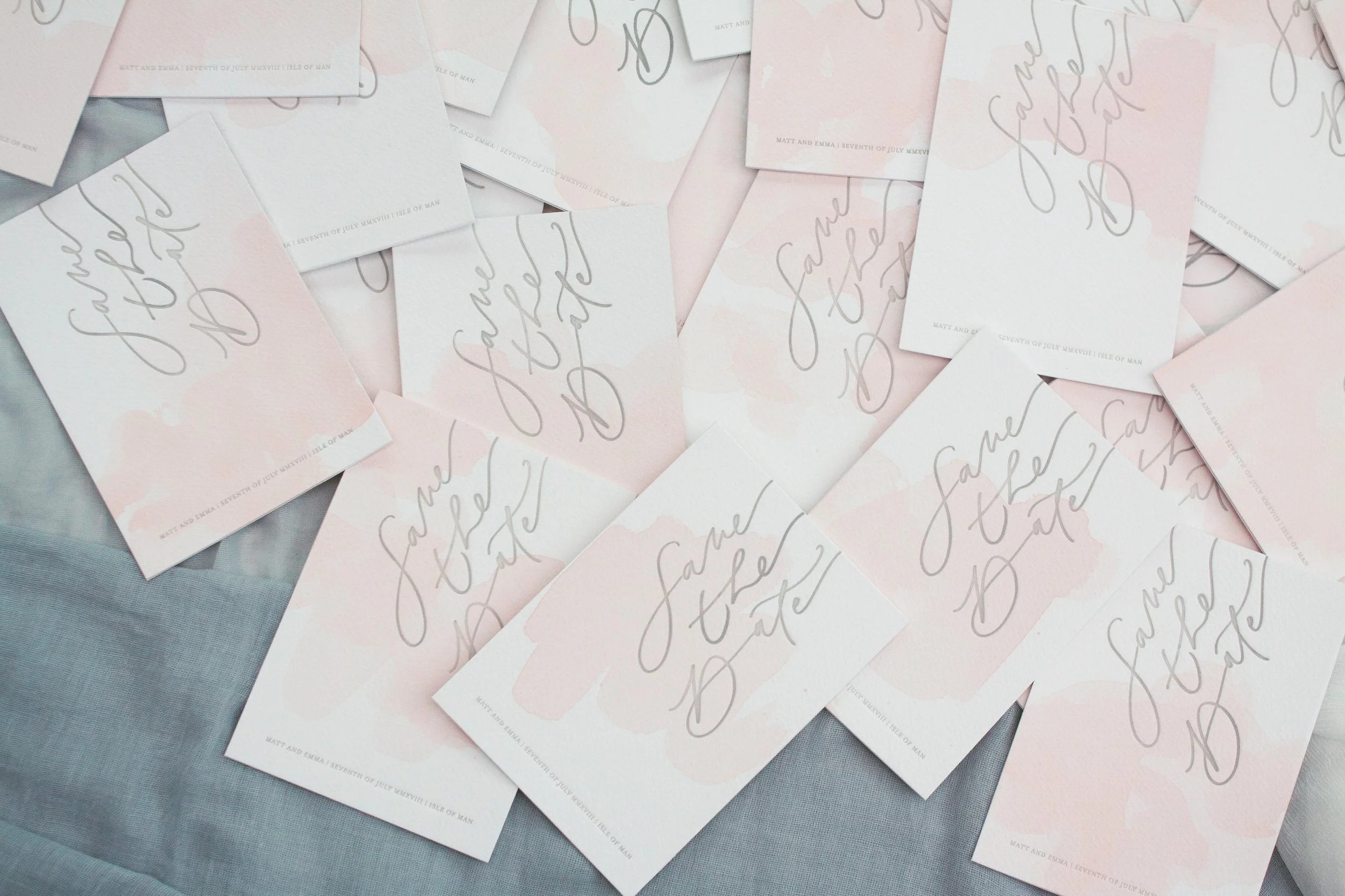 Individually watercoloured and letterpress printed save the dates.