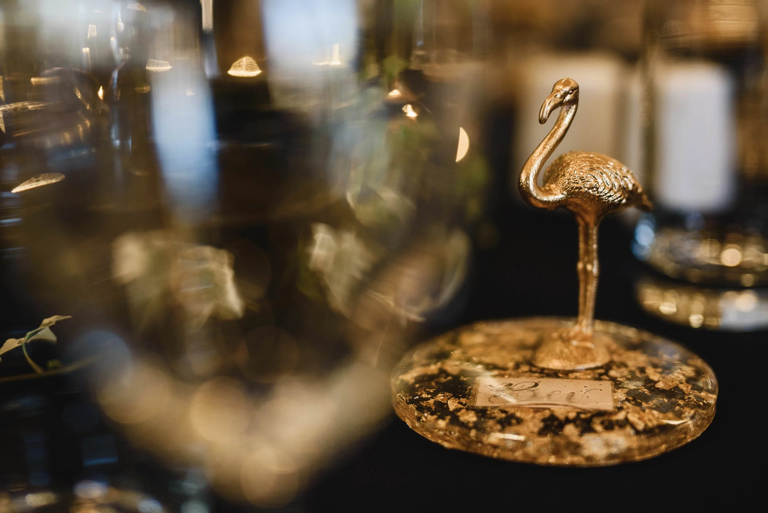 Name places as mini works of art. Calligraphy names laminated and sunk in the resin along with gold leaf. Cured in the sun and schleich animals spray painted gold and attached to give some whimsy to the table. 