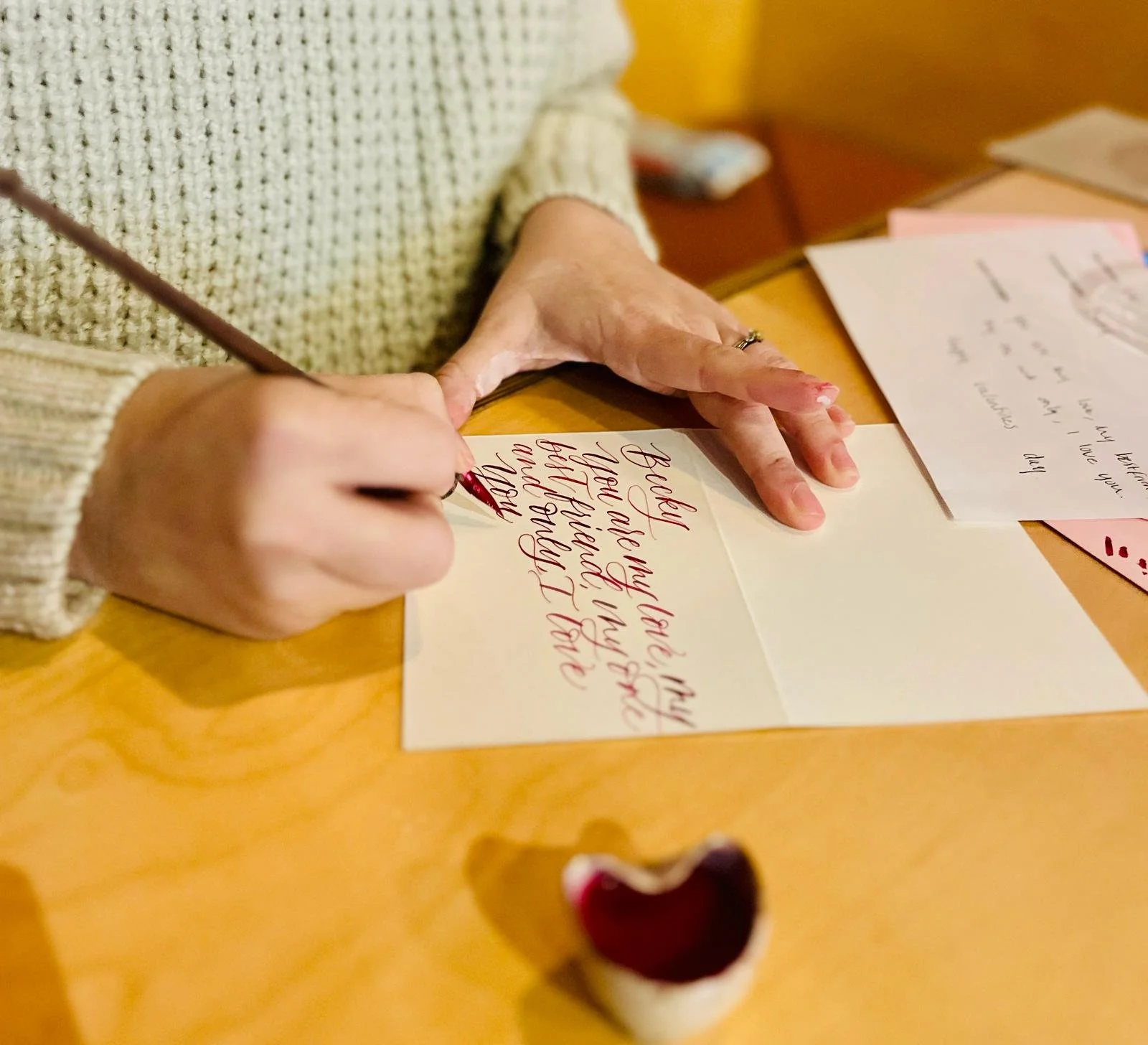 My client arranged for employees in the buildings they manage to choose a handmade paper rose and have their message written live on a card of their choosing