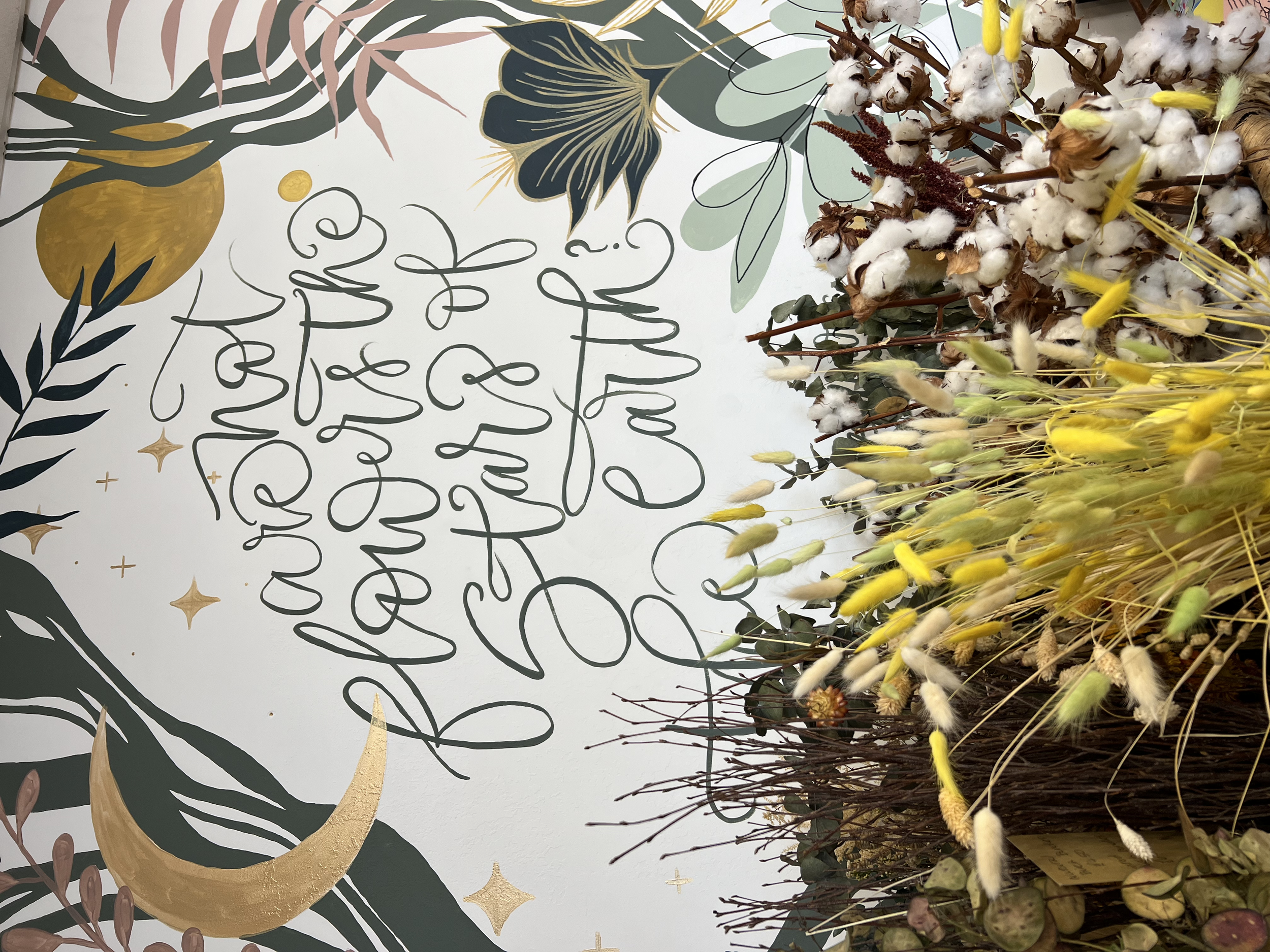 Full wall mural calligraphy in a floral design store