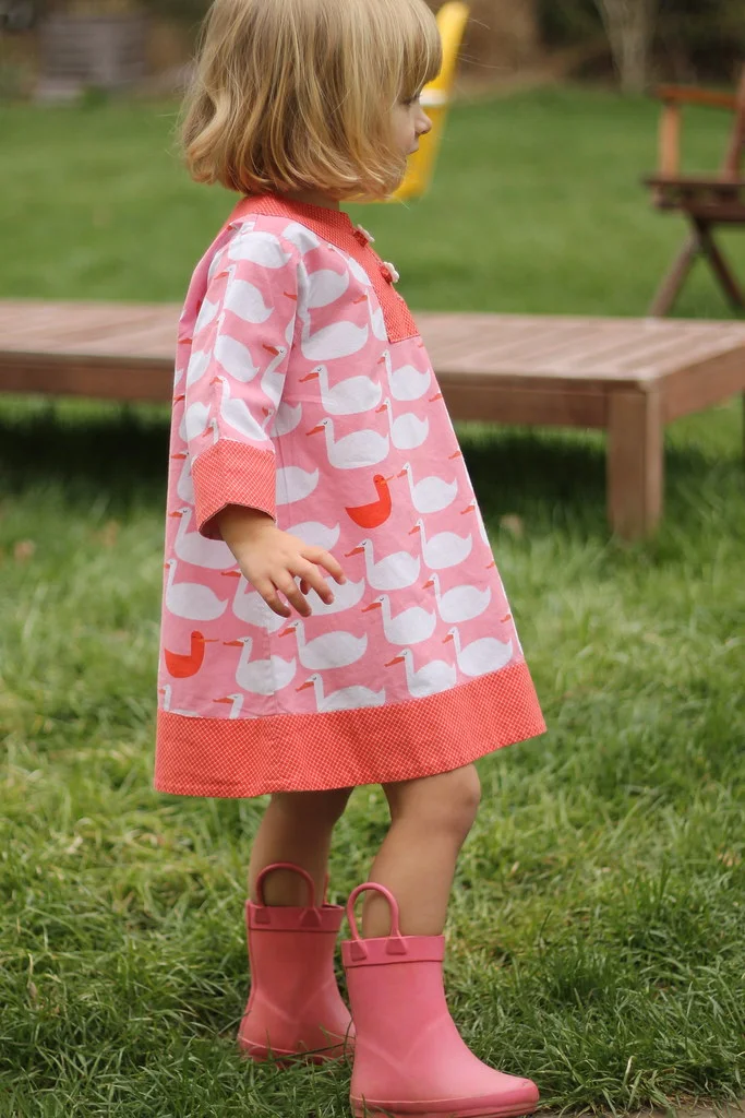 Growing like a little weed right out of her Charlie Dress