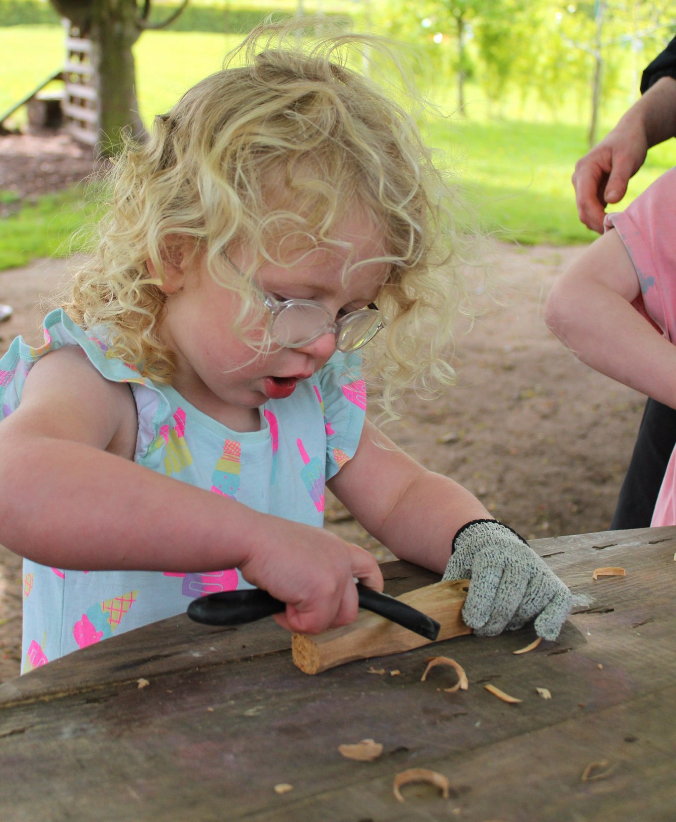 Child Whittling Wood