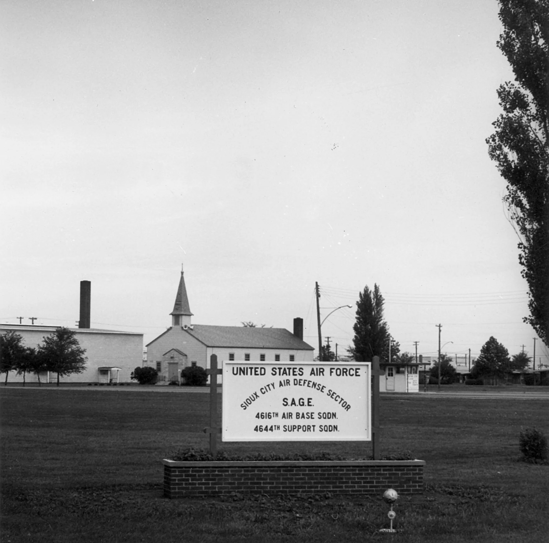 Base signage with Chapel Building 2 in background