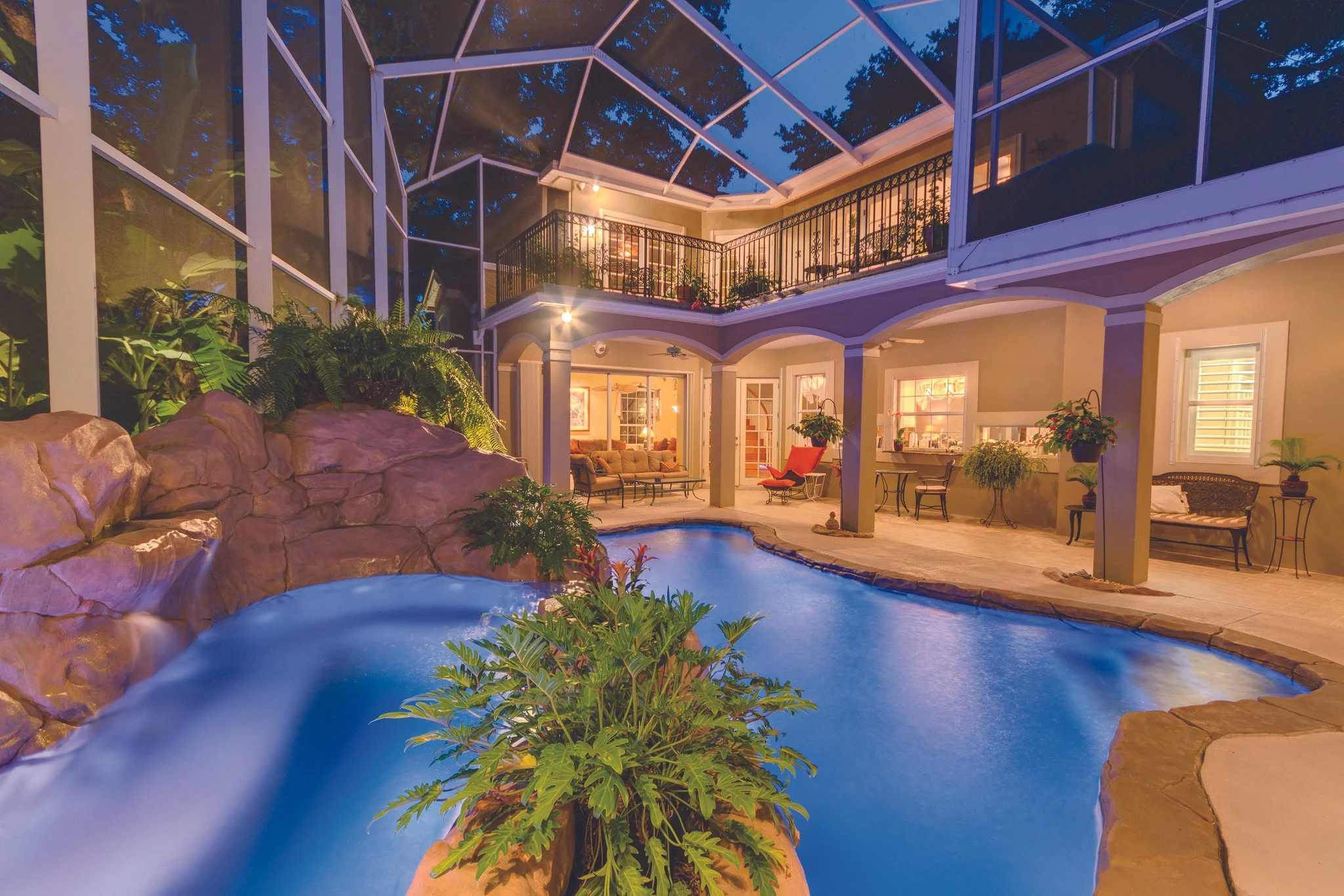 backyard pool oasis at night