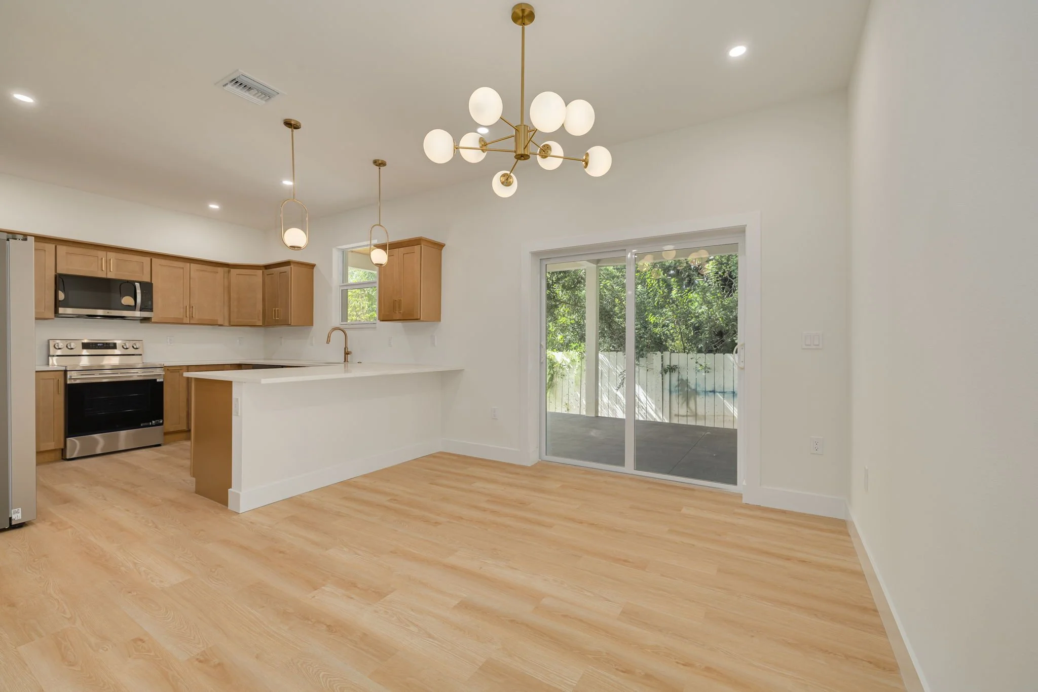 modern kitchen with quartz countertops and pendant lighting