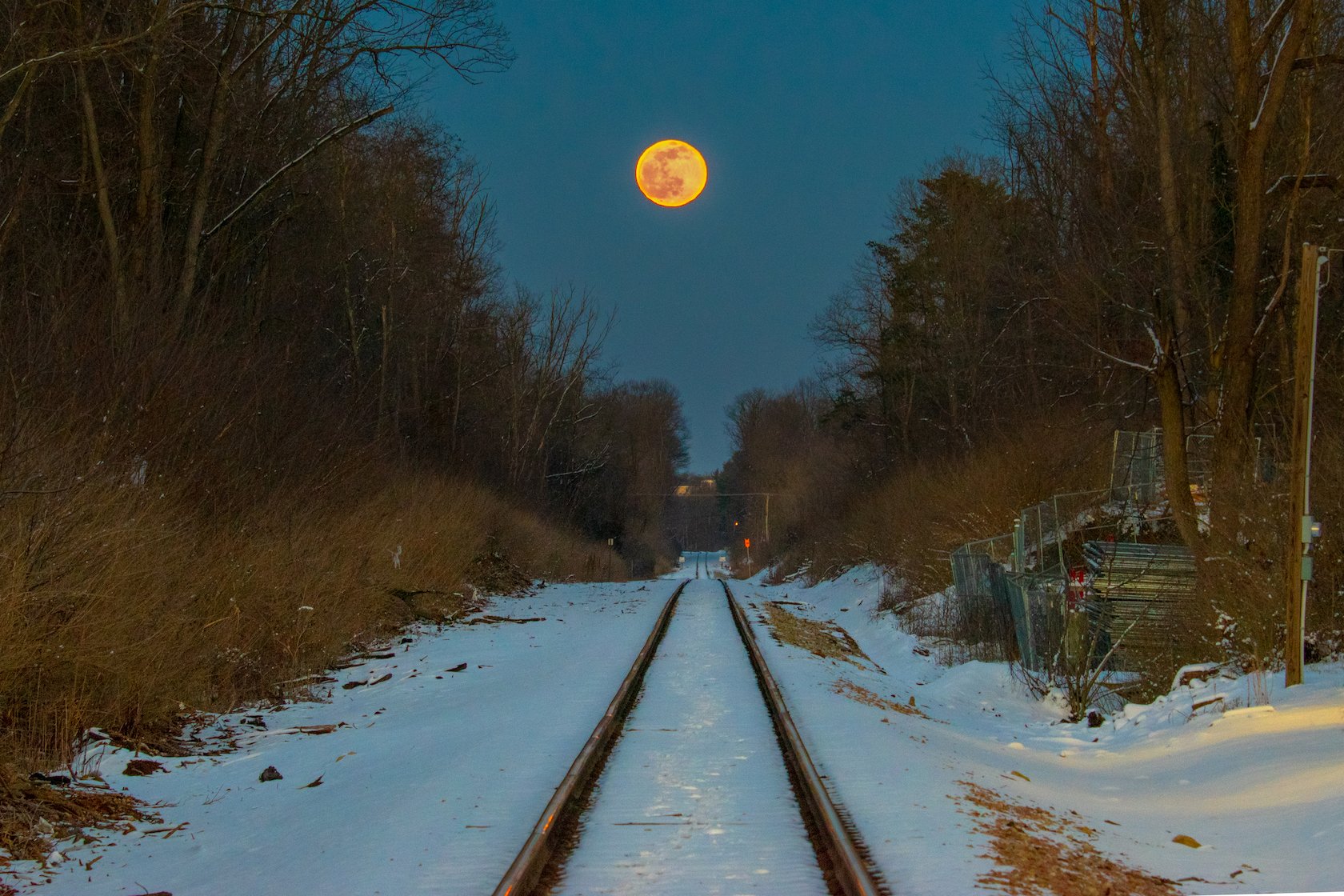 Moonrise over train-tracks