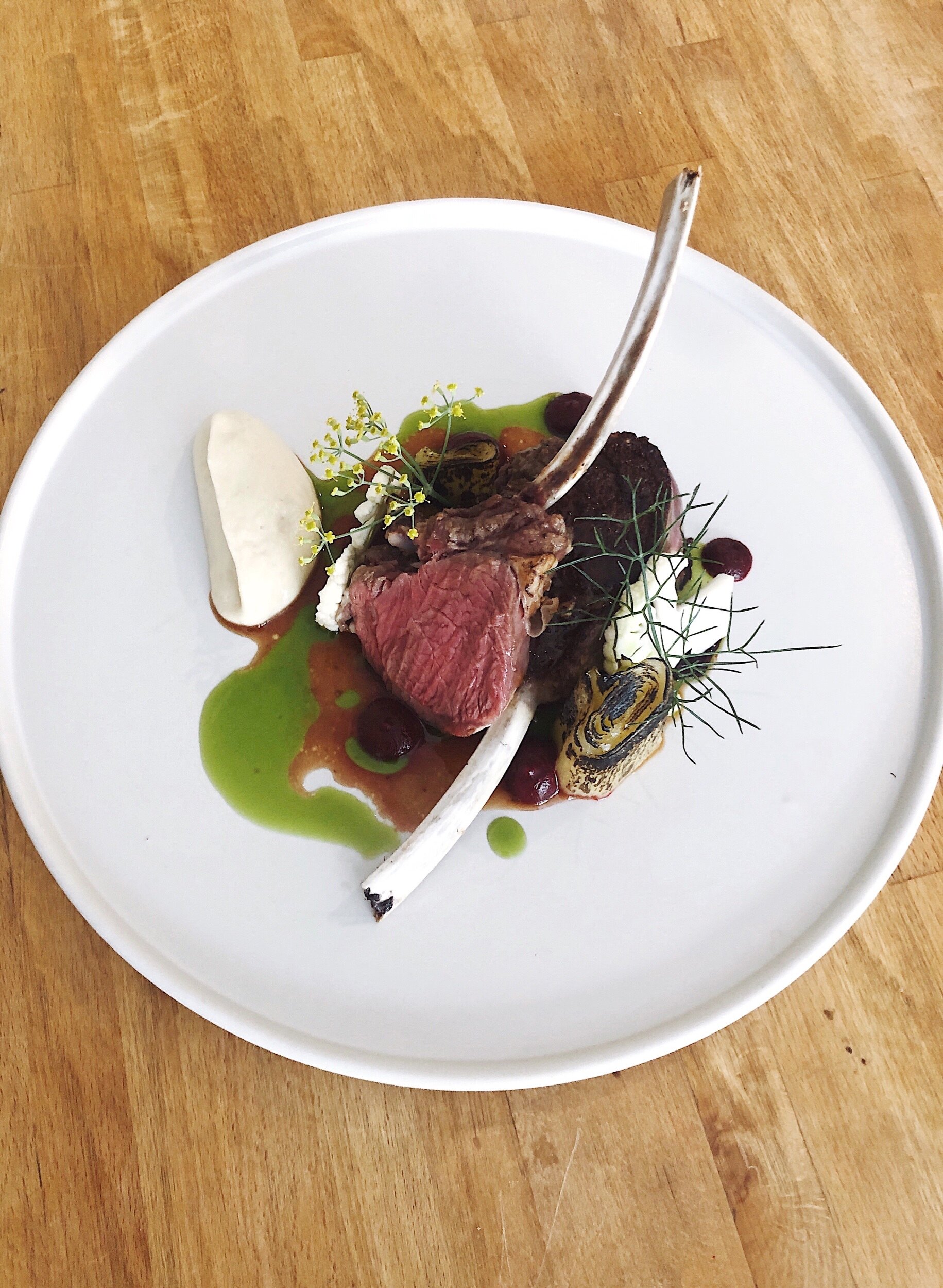 Venison Rack with Beet Leaves, Beetroot Puree, Burnt Leek, Leek Oil, Pickled Cauliflower, Cauliflower Puree, Reduction Sauce