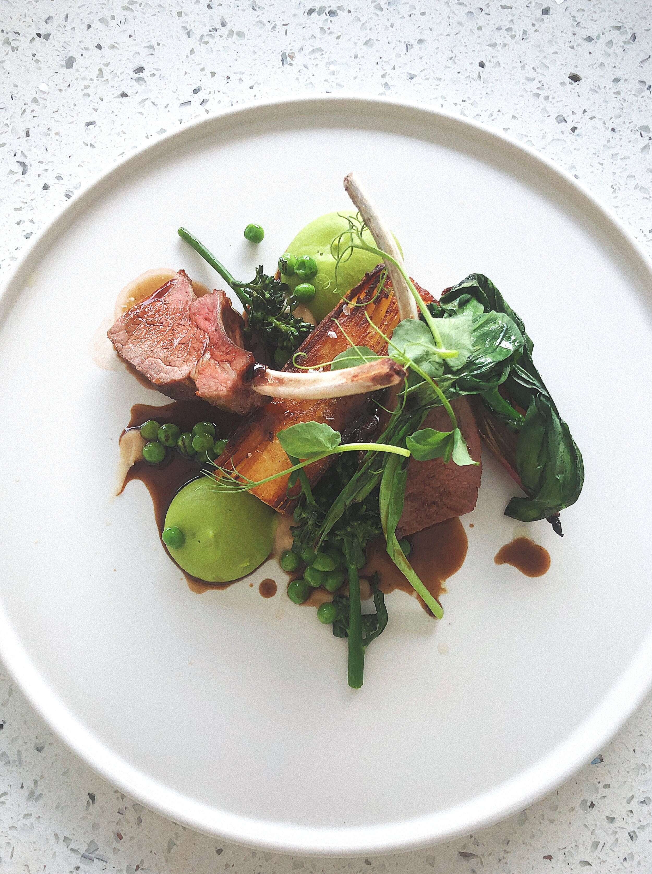 Rack of Lamb, Pavé Potato, Confit Shallot, Pea, Tenderstem Broccoli, Wild Garlic, Reduction Sauce