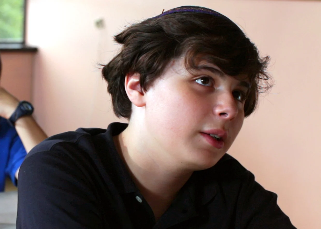 Markus Goldberg (Dovi) Markus lives in upstate New York, and has been involved in acting for several years. David was Markus’ debut in a feature narrative. Markus auditioned for the role of one of the Jewish boys, and had a callback for the part of Moishe. In order to get the role Markus needed to cut his hair and put on a more conservative look! Being Jewish, working on David was a great experience to engage with different religious situations and locations. Q. What he does: A. I love watching movie, making movies, being in movies! Q. Favorite production moment: A. Riding the Cyclone at Coney Island! Q. Most difficult aspect of production: A. The heat! It was really hot both outside and in the interior shots in the yeshiva classroom.